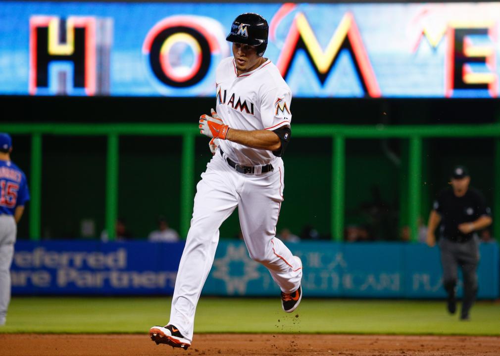 Giancarlo Stanton #27 of the Miami Marlins runs the bases after hitting a home run.