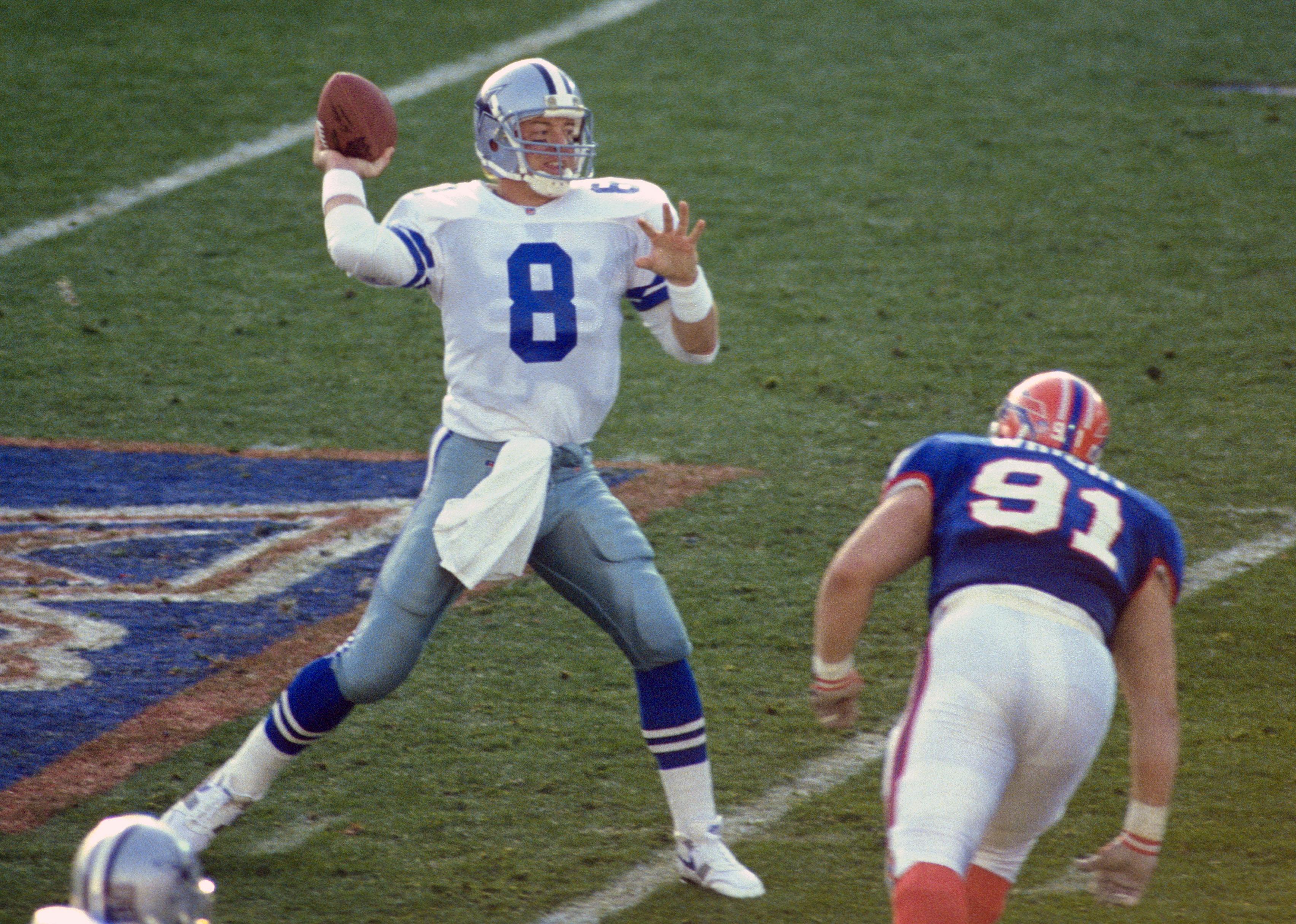 Troy Aikman of the Dallas Cowboys drops back to pass during Super Bowl XXVII.