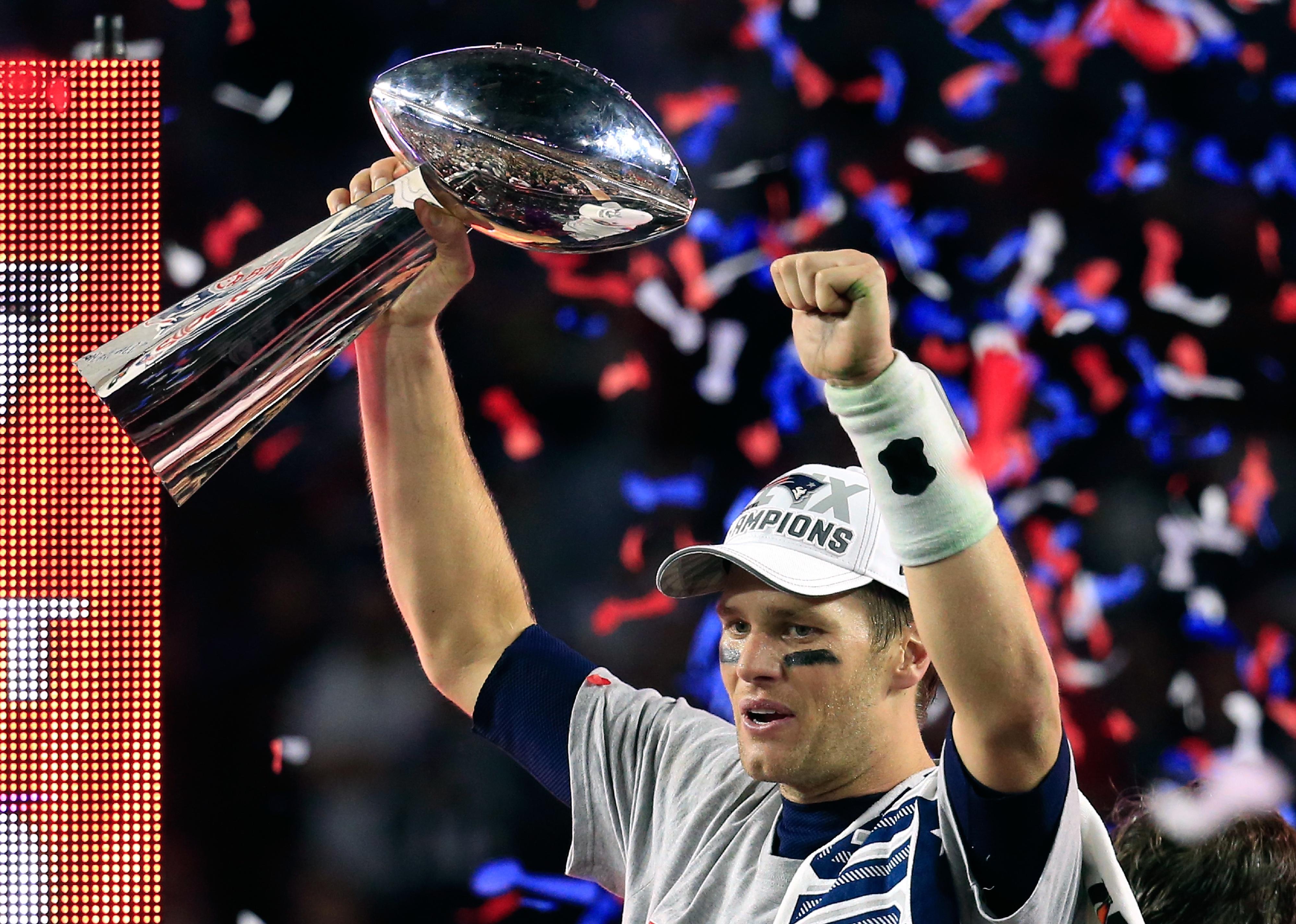 Tom Brady of the New England Patriots celebrates with the Vince Lombardi Trophy.