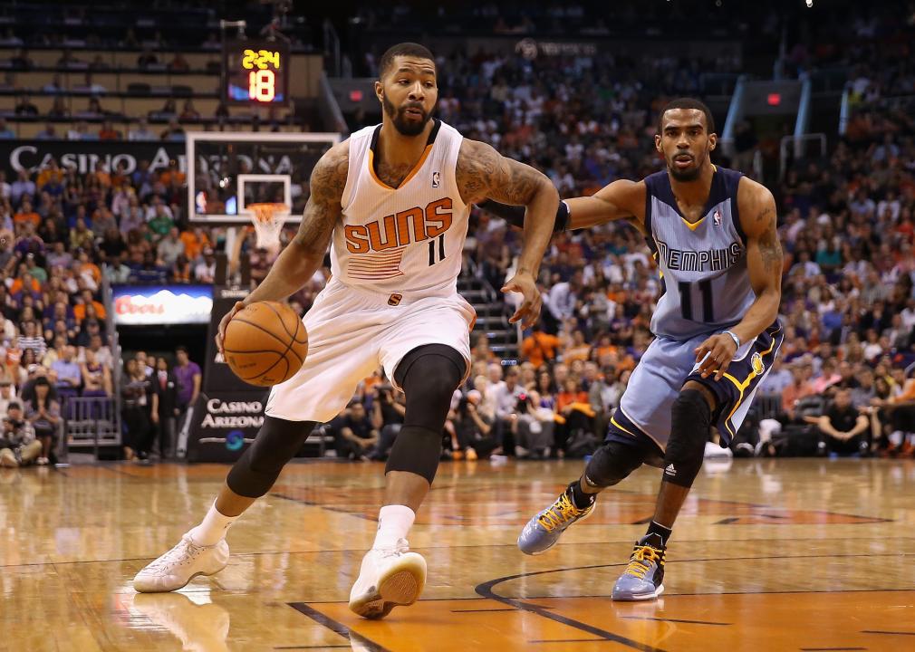 Markieff Morris of the Phoenix Suns drives the ball past Mike Conley of the Memphis Grizzlies.
