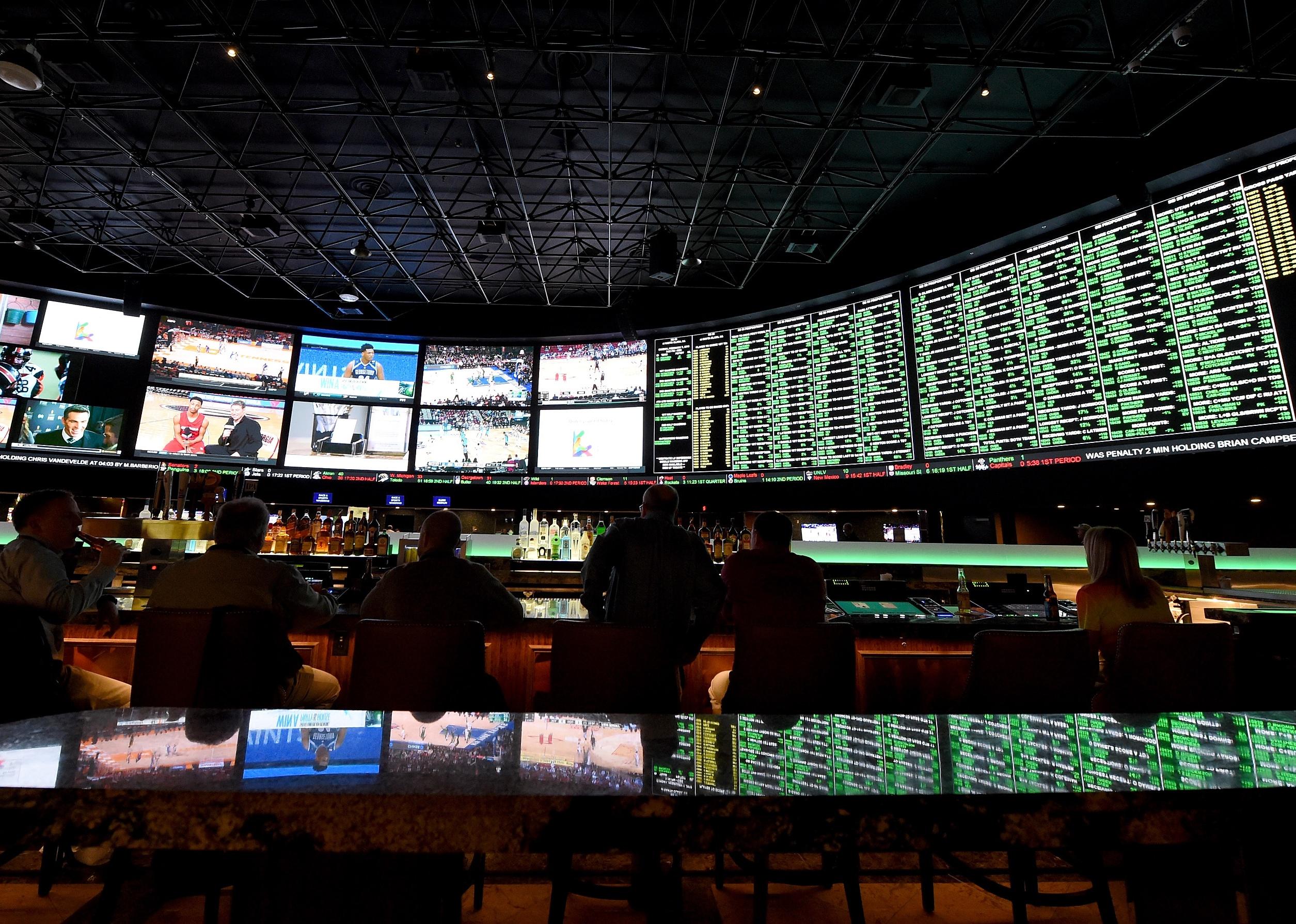Screens showing games along with the betting line and some of the nearly 400 proposition bets for Super Bowl 50.