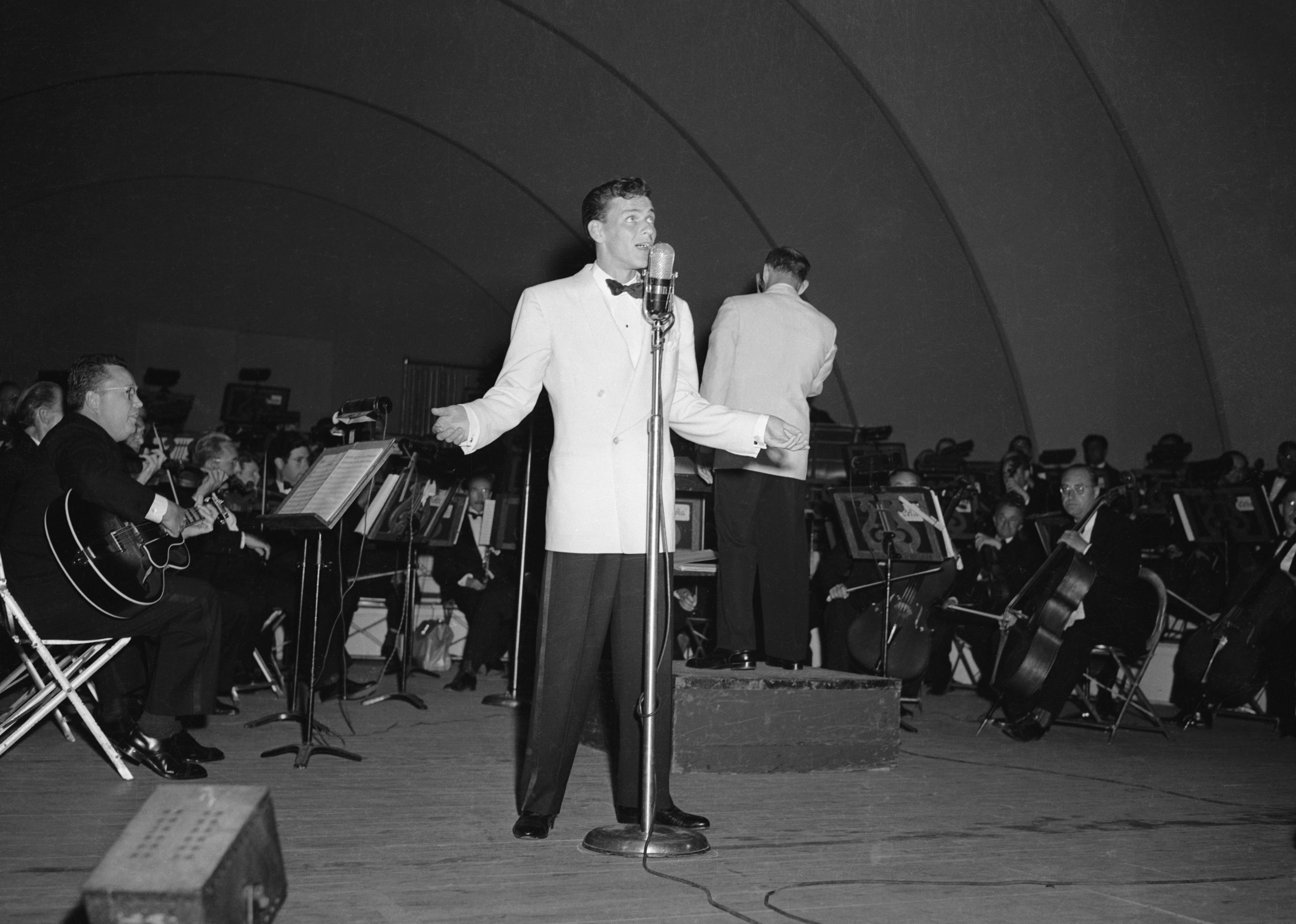 Frank Sinatra performs at the Hollywood Bowl. 