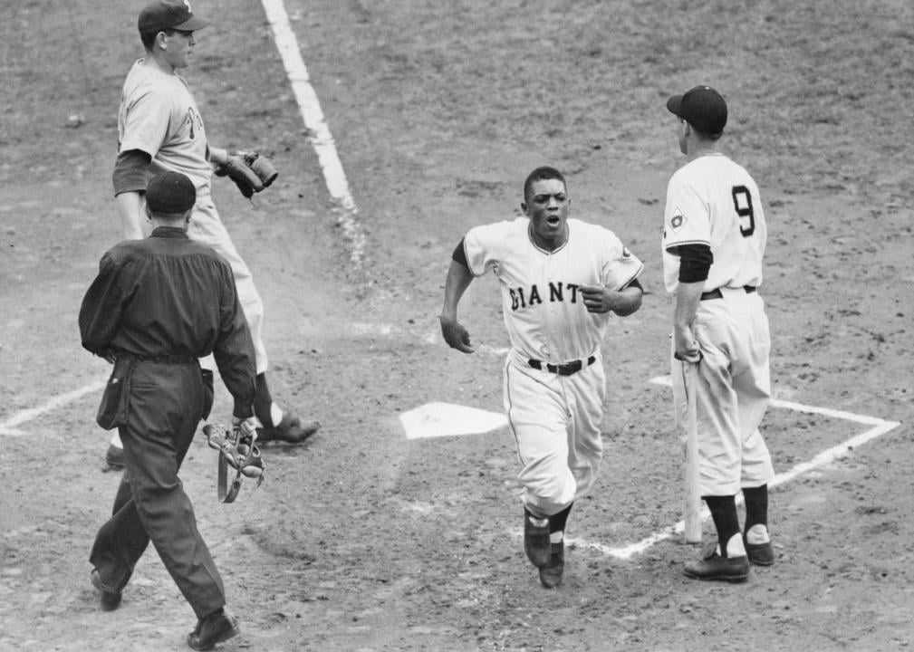 Willie Mays of the Giants crossing home plate