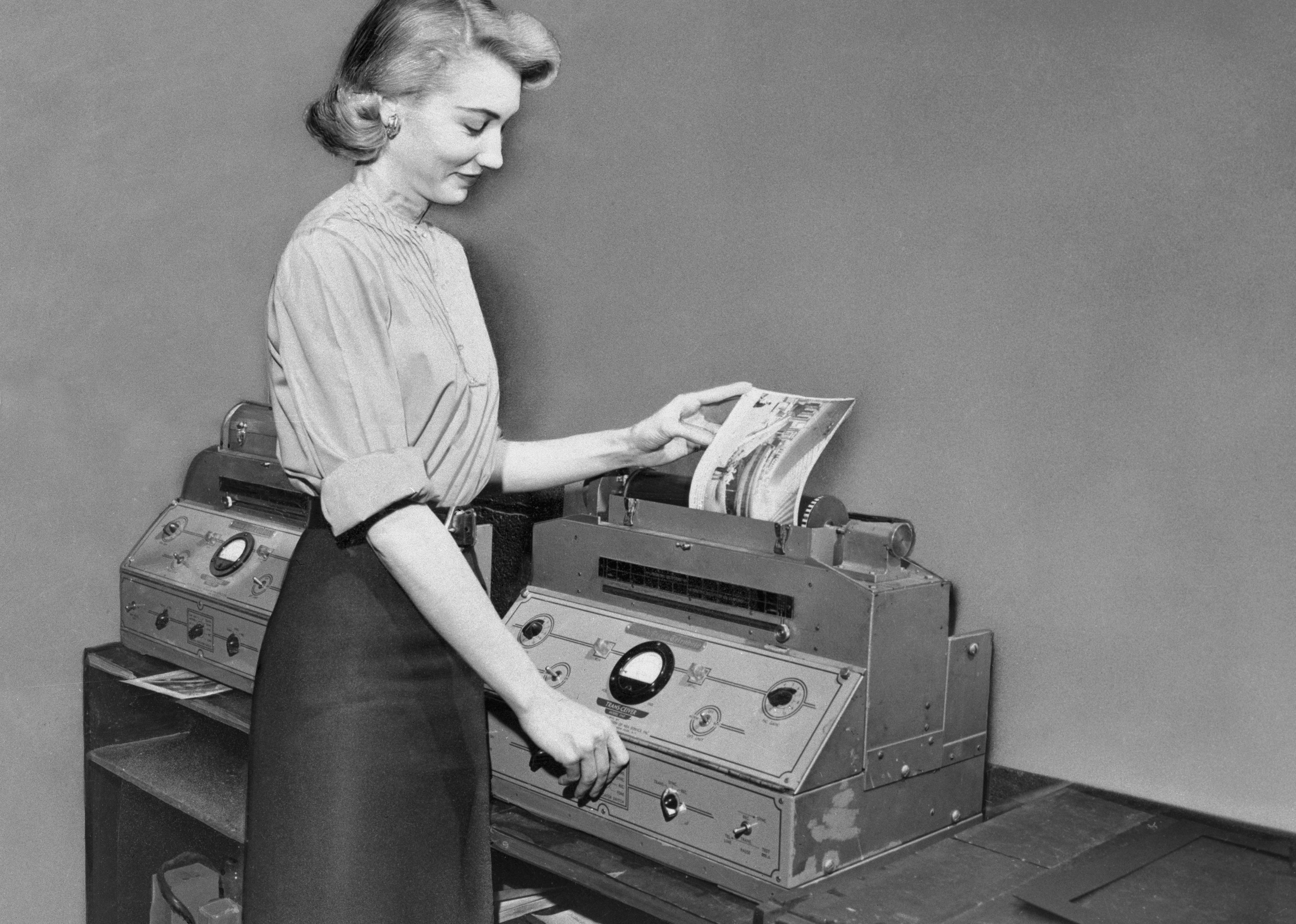 Woman transmitting news photograph