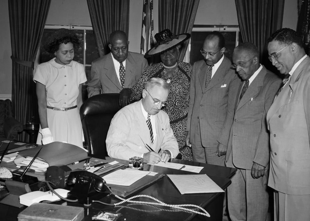 President Harry Truman signs a proclamation 