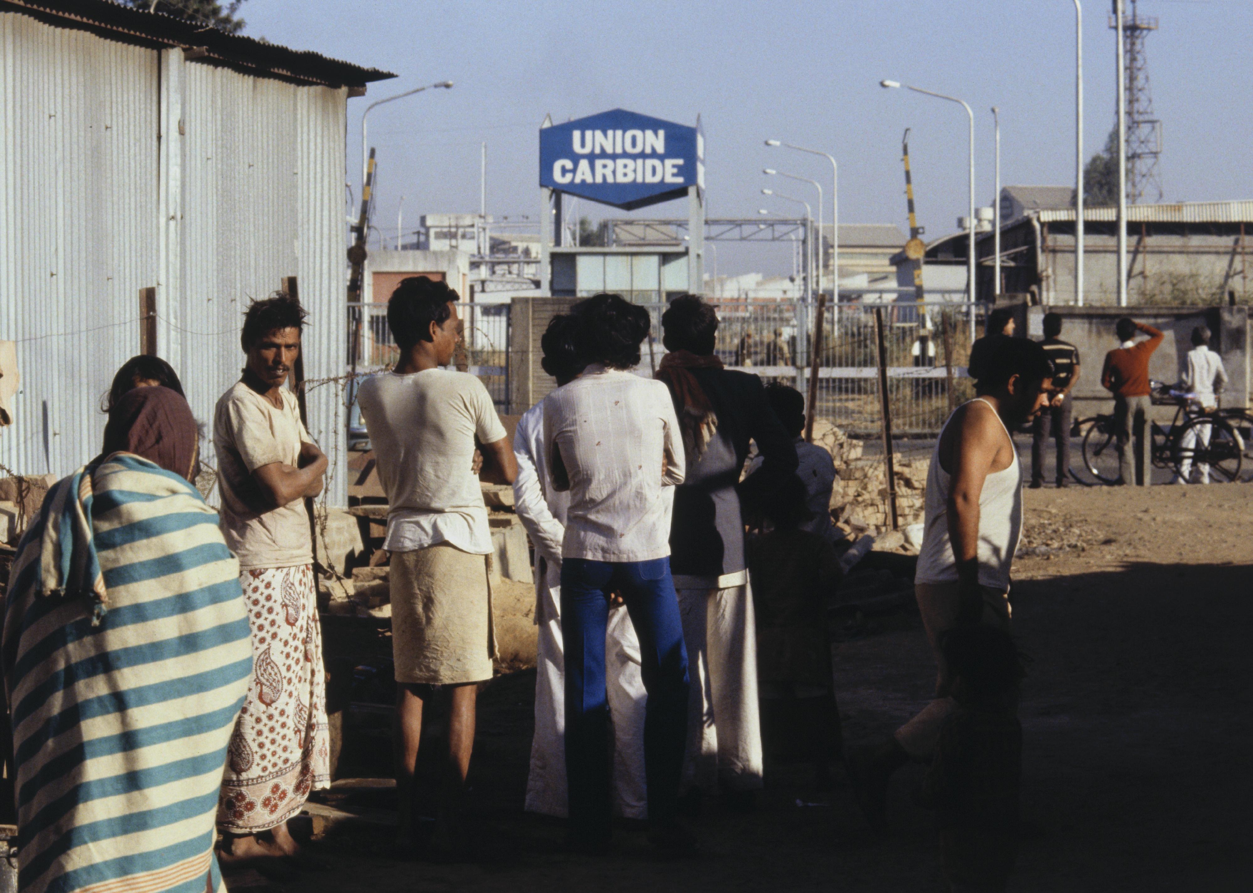 Men at Union Carbide Plant Entrance.