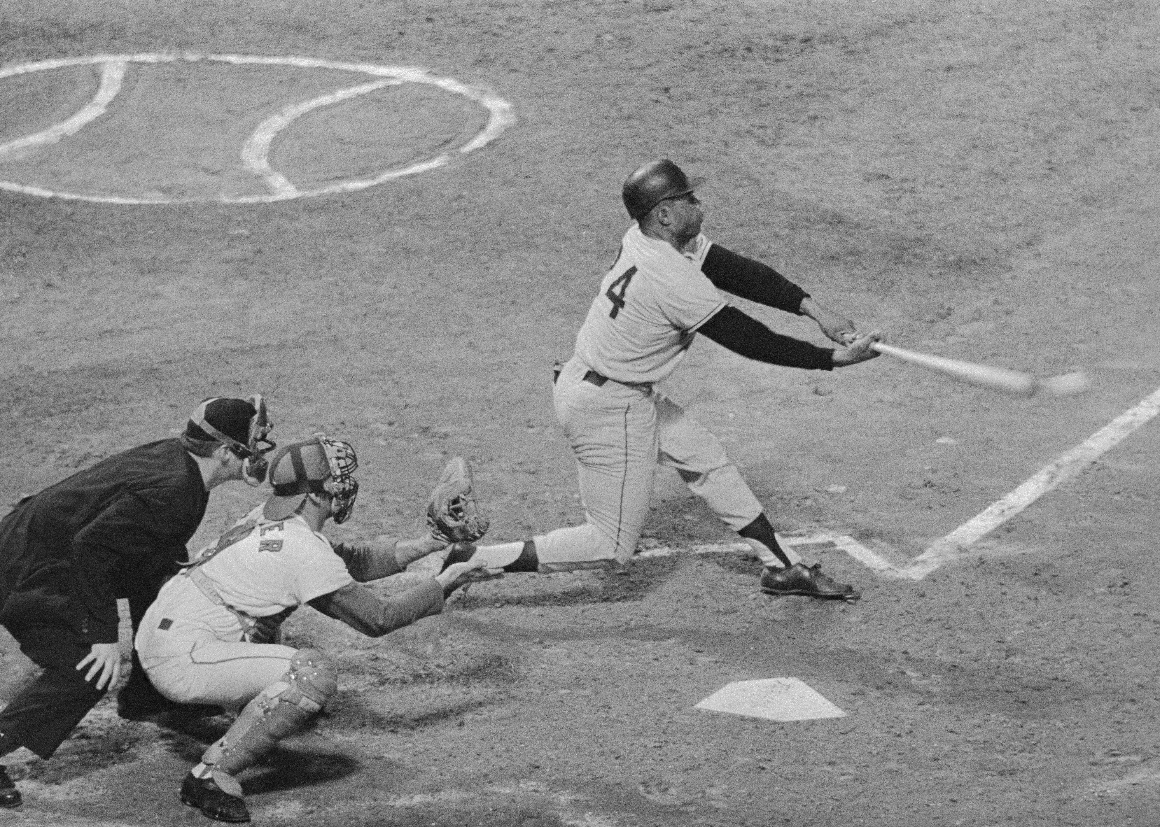 Willie Mays swings a bat for his first run of a Cards-Giants game.