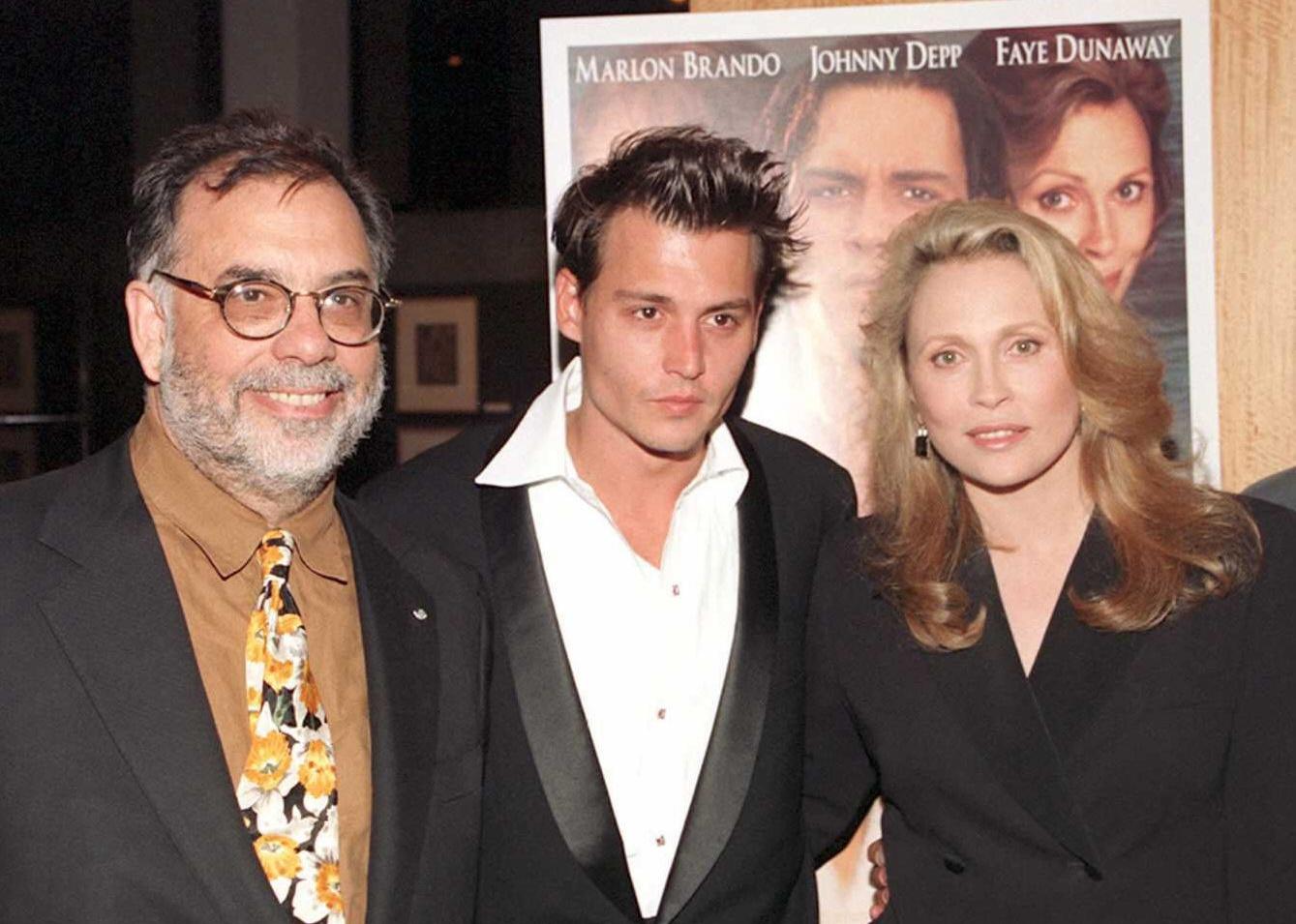 Producer Francis Ford Coppola poses with Johnny Depp and Faye Dunaway at the premiere of "Don Juan DeMarco".