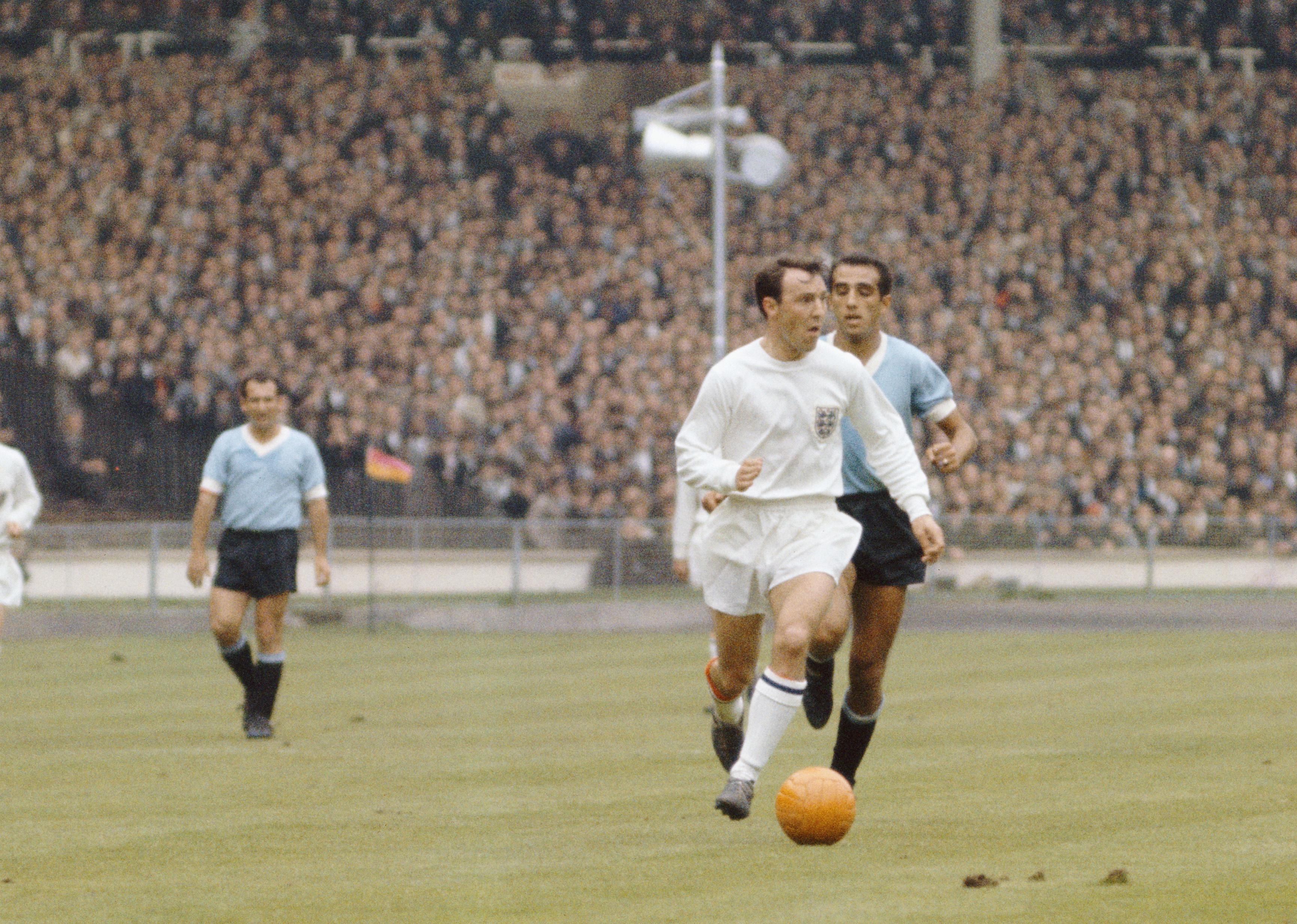 England striker Jimmy Greaves outpaces a Uruguay defender during the 1966 World Cup Finals.