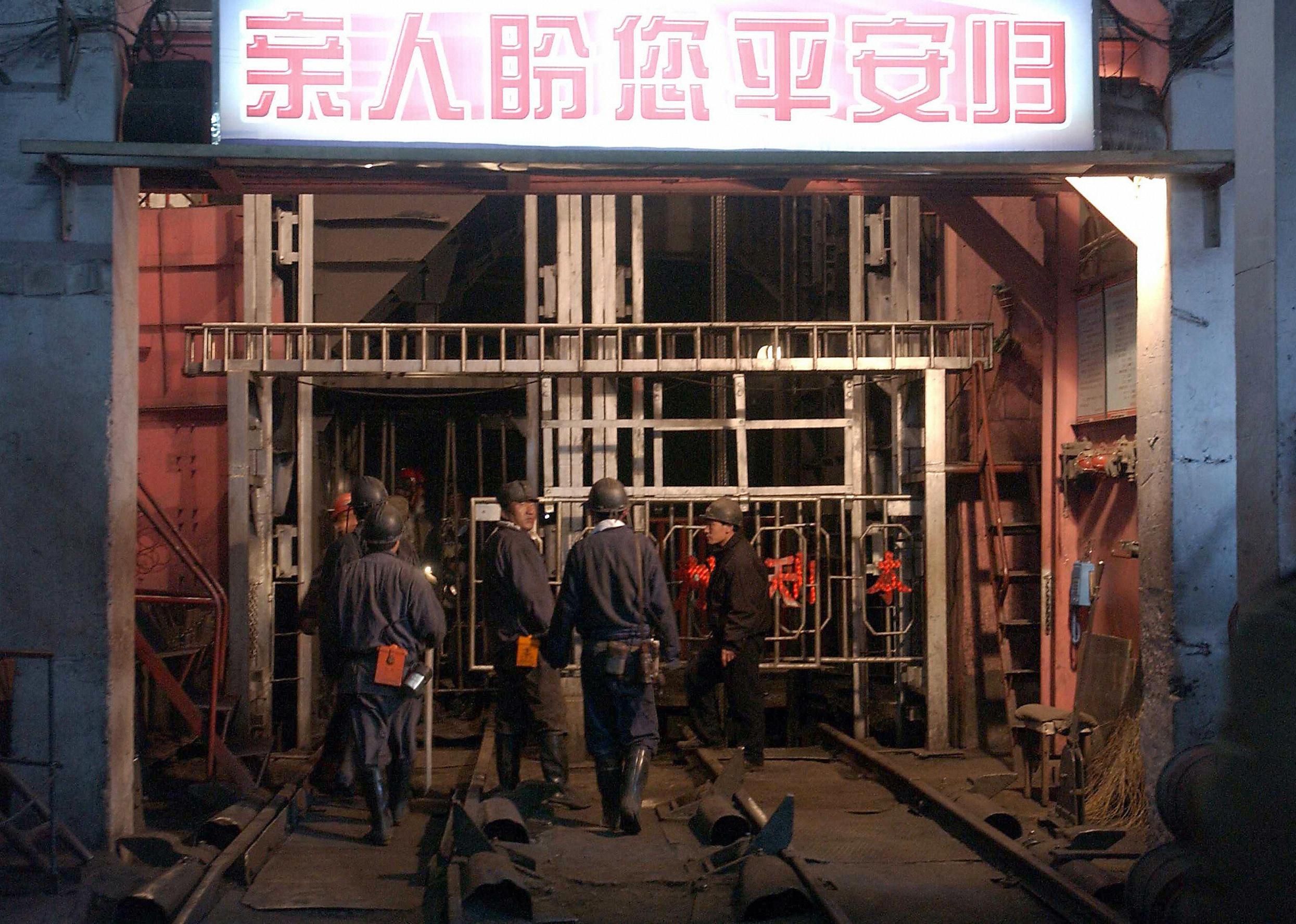 A team of miners prepare to enter into the Sujiawan colliery in Fuxin city.