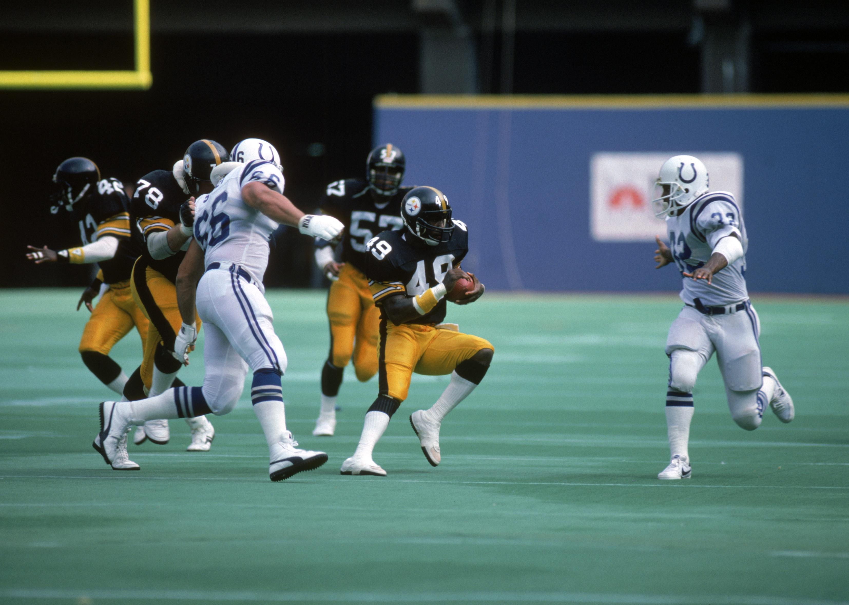 Cornerback Dwayne Woodruff #49 of the Pittsburgh Steelers returns an interception.