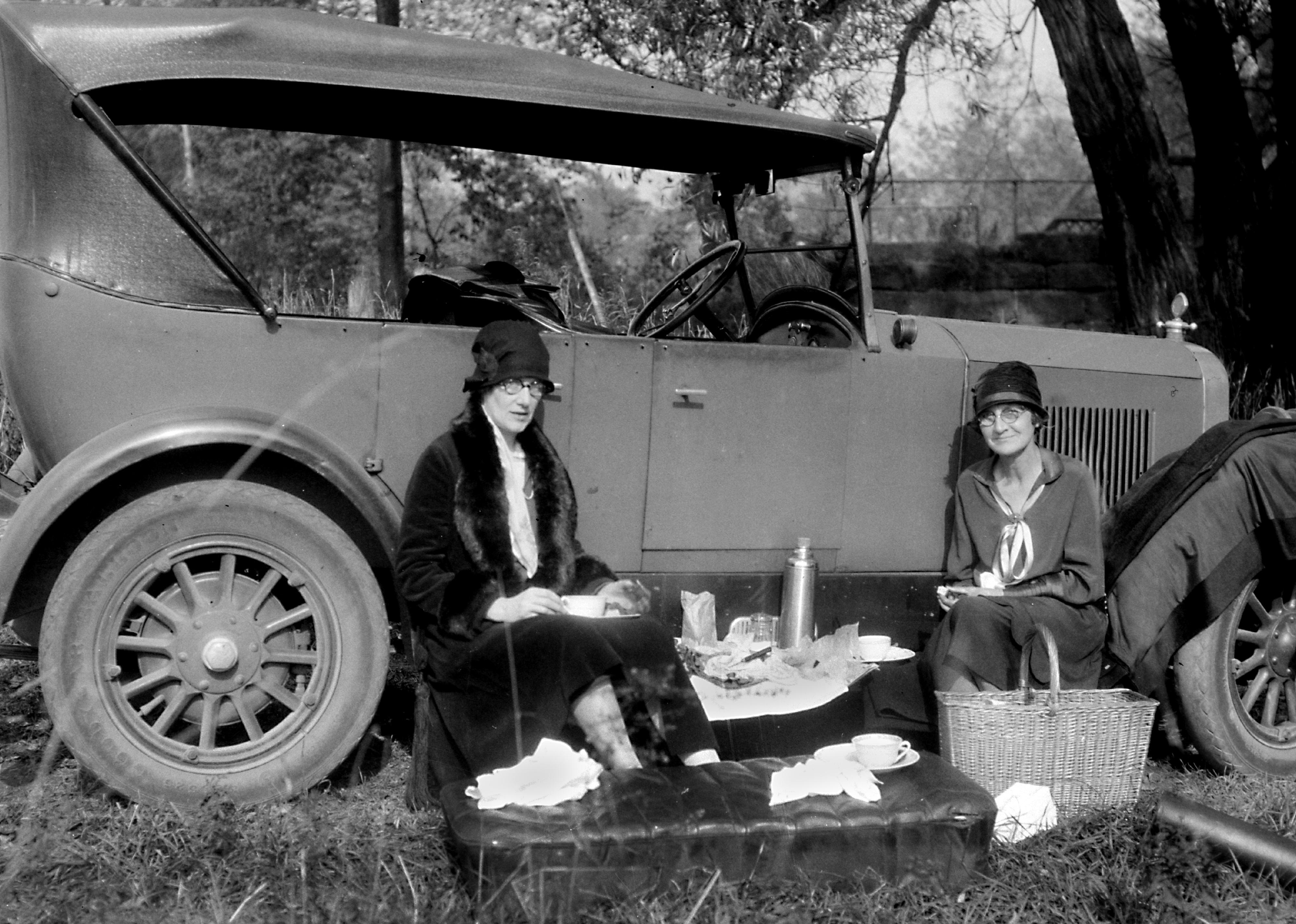 Roadside picnic along the car, circa 1920.