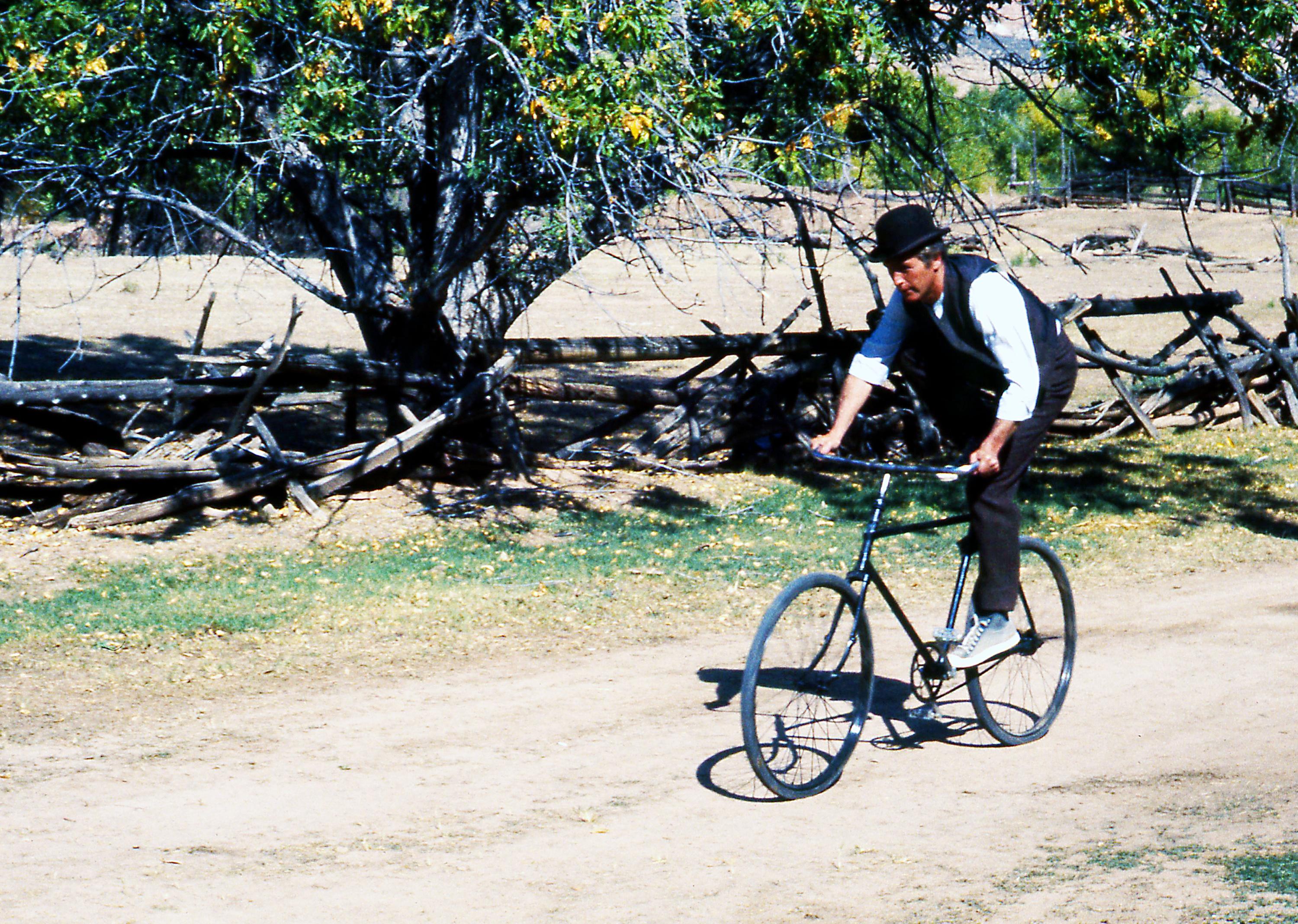 Paul Newman on a bike as Butch Cassidy, in Butch Cassidy And The Sundance Kid.