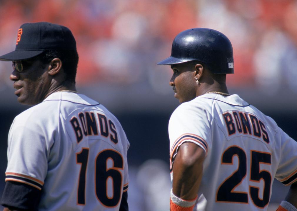 Bobby Bonds stands next to his son, Barry Bonds of the San Francisco Giants, during a game.