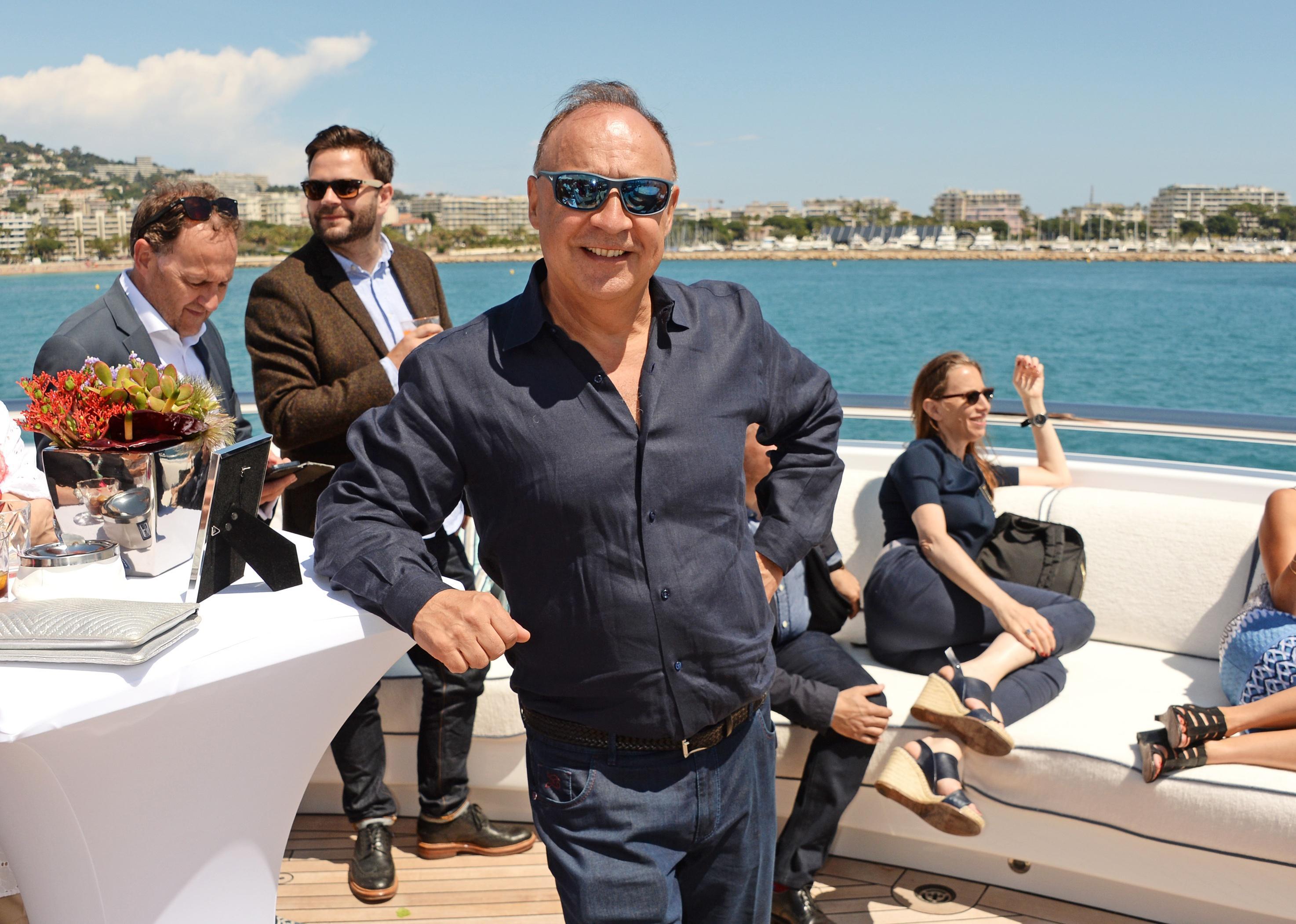 Len Blavatnik poses for photo on yacht.