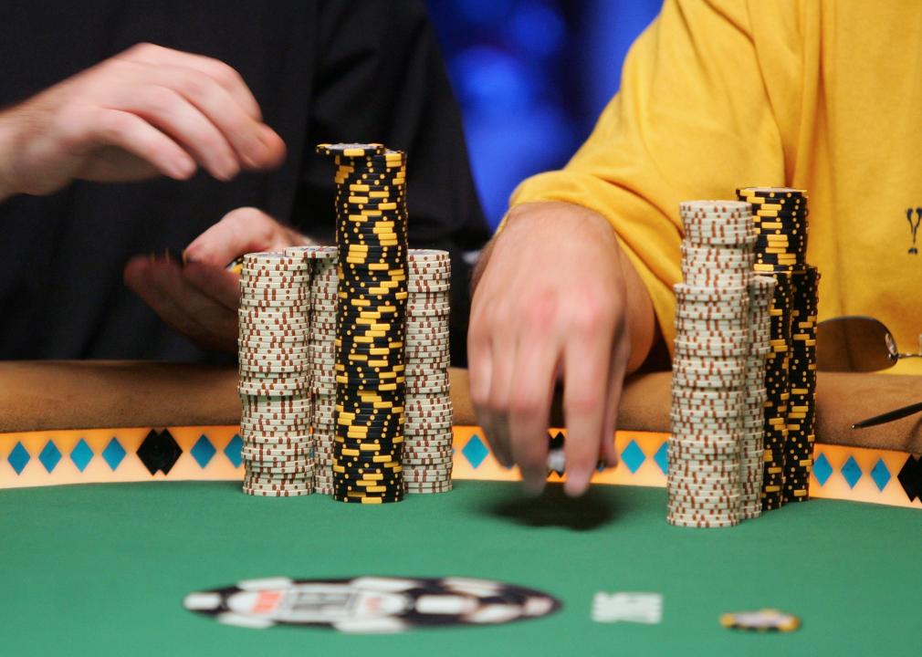 Players stack their chips during a poker game.