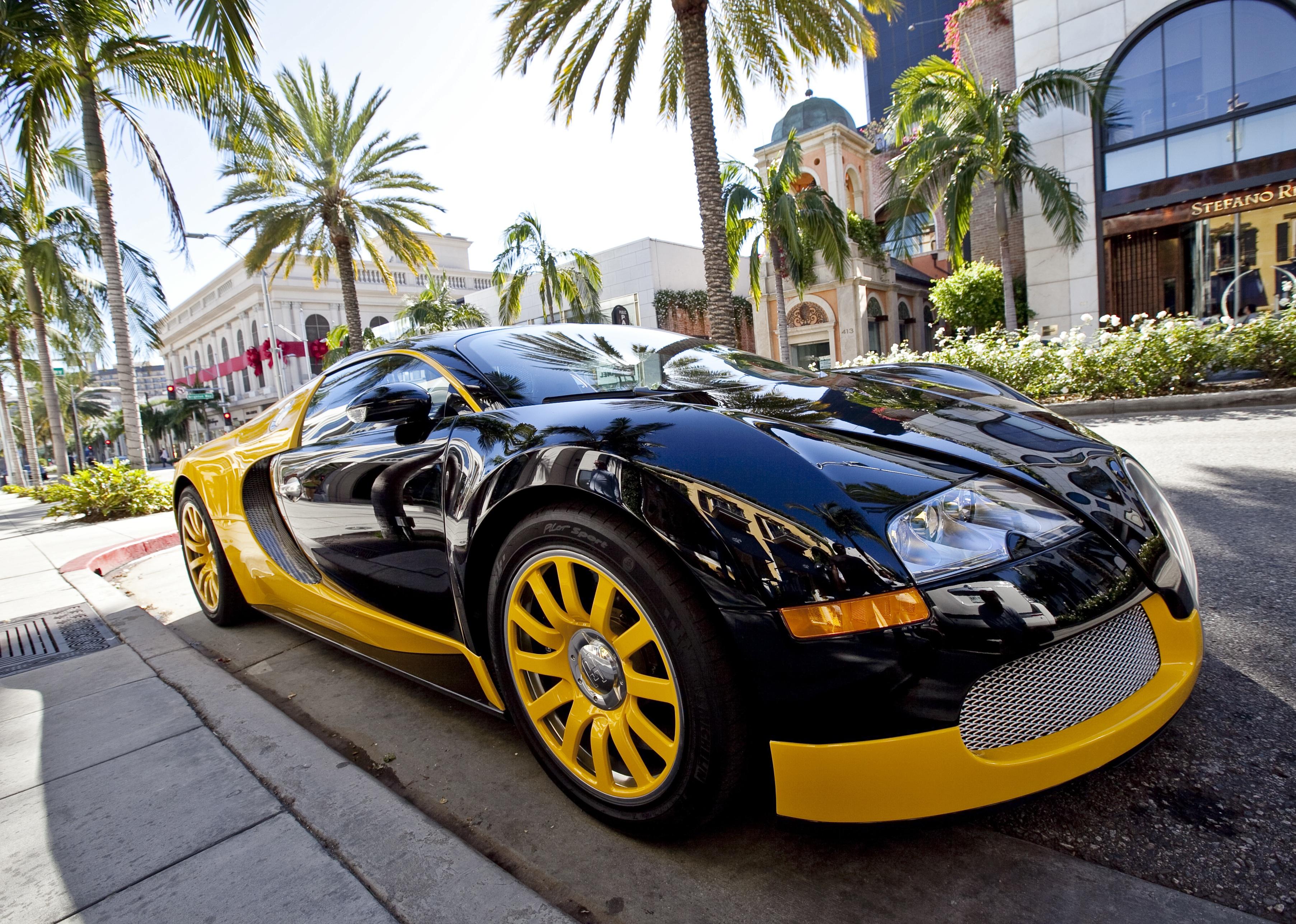 A million dollar Bugatti Veyron owned by fashion designer Bijan parked in front of his Rodeo Drive store.