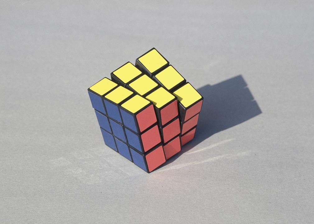 Close up on a Rubik’s Cube puzzle on a white background.