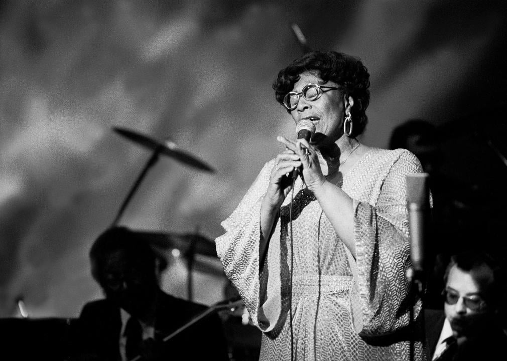 Ella Fitzgerald performing onstage.