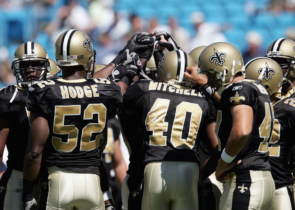 Members of the New Orleans Saints defense huddle.