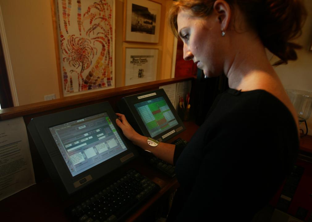 Restaurant staff member taking a look at Opentable.com software.