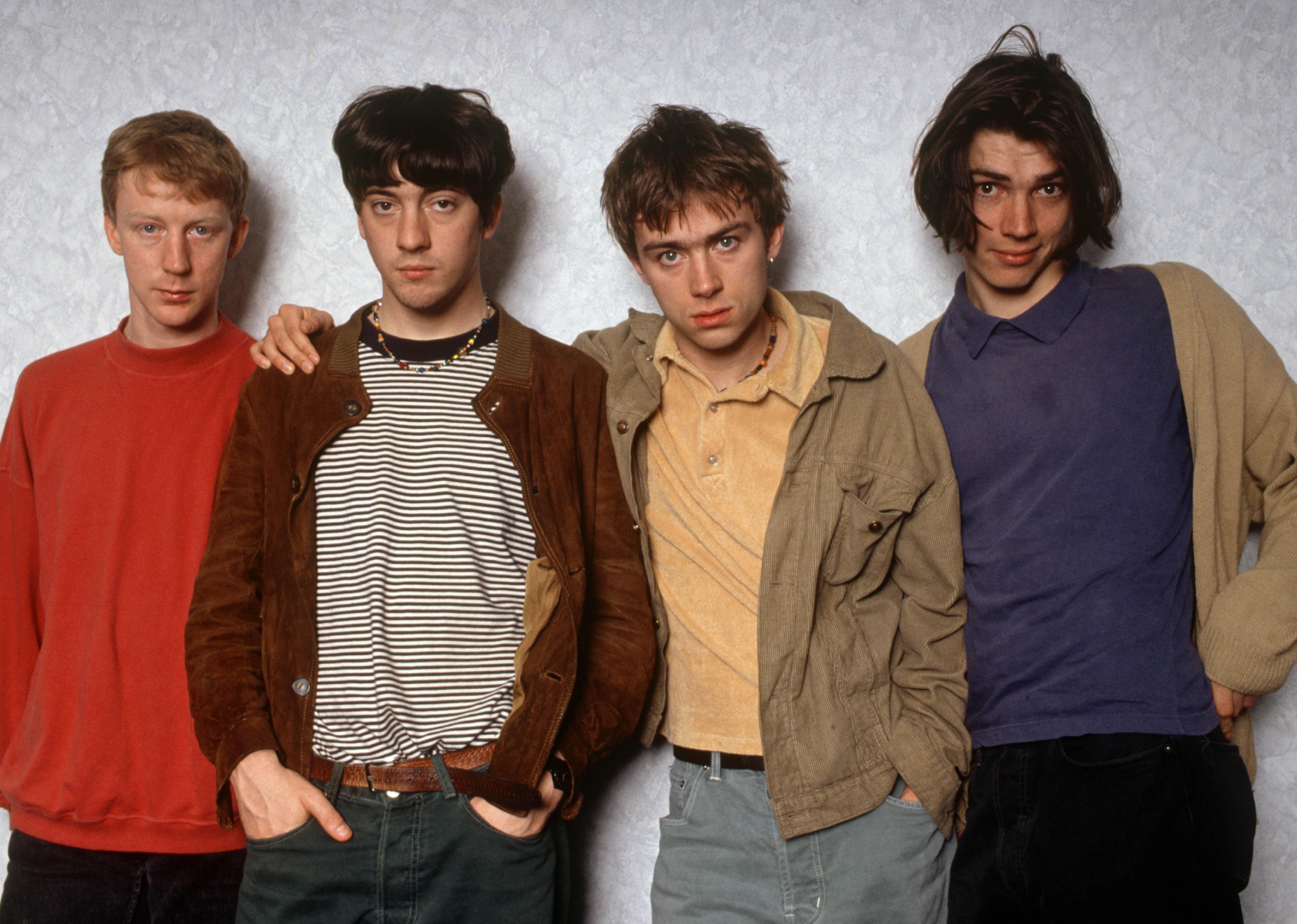 Dave Rowntree with the members of Blur.