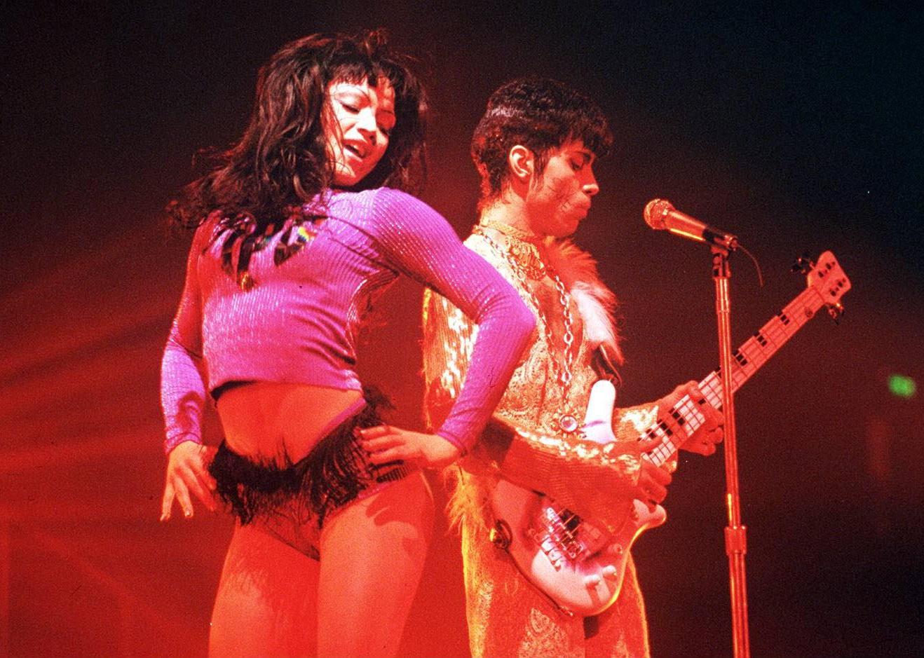 Prince with Mayte Garcia onstage.