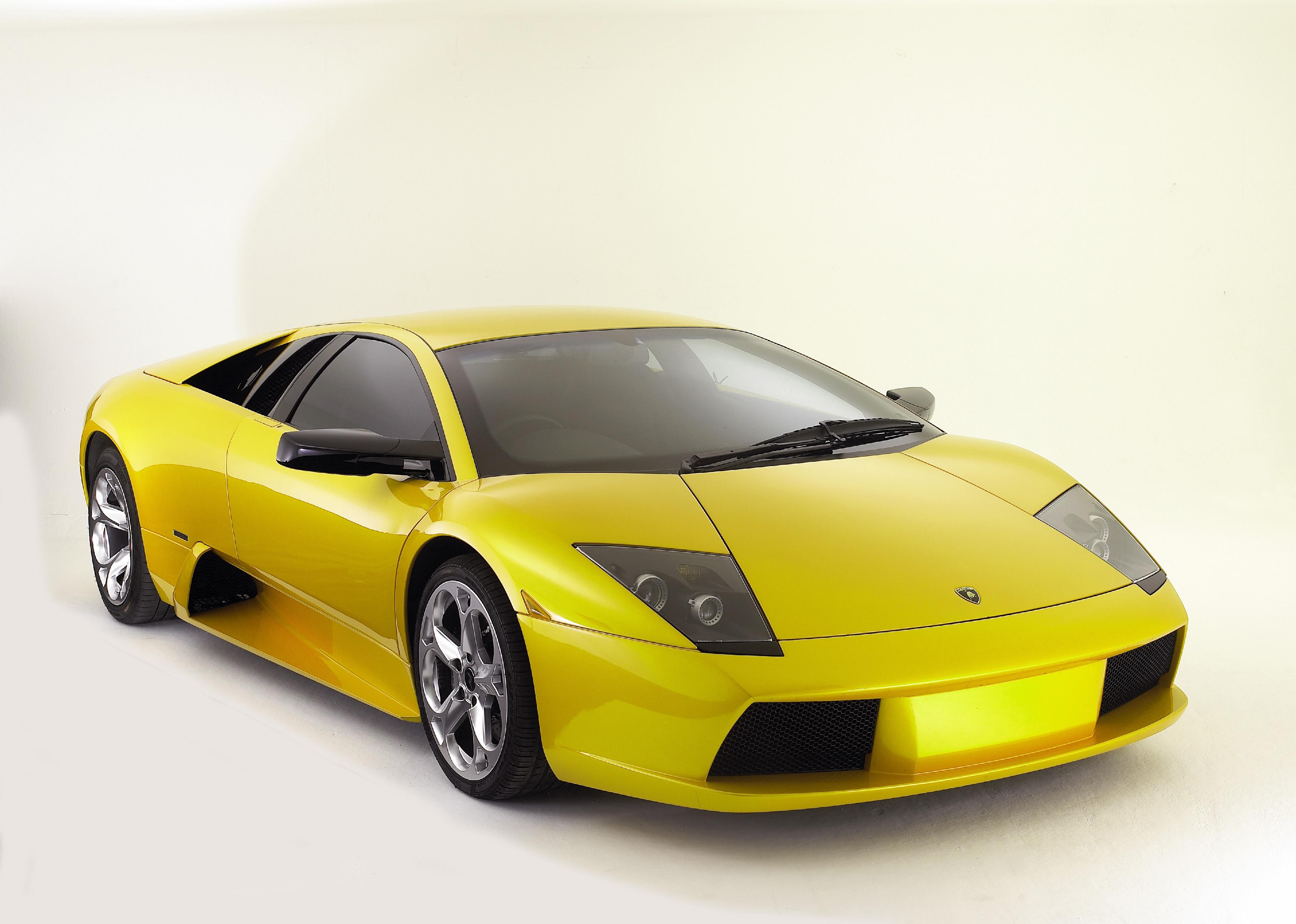 Yellow early 2000s Lamborghini Mucielago.
