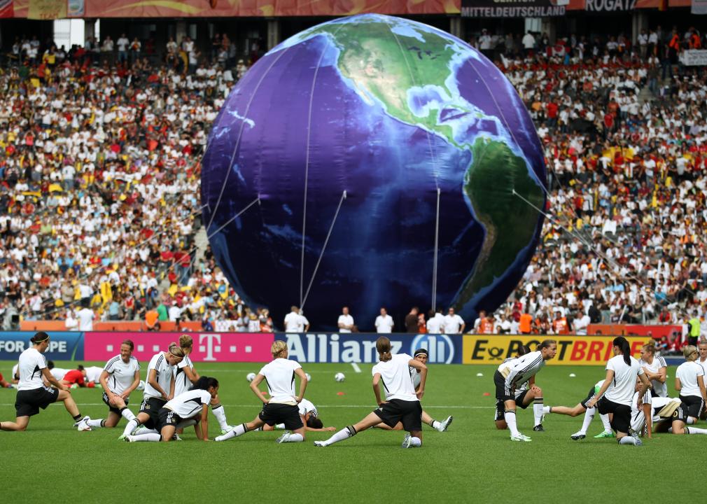 The German womens team warms up in front of a globe