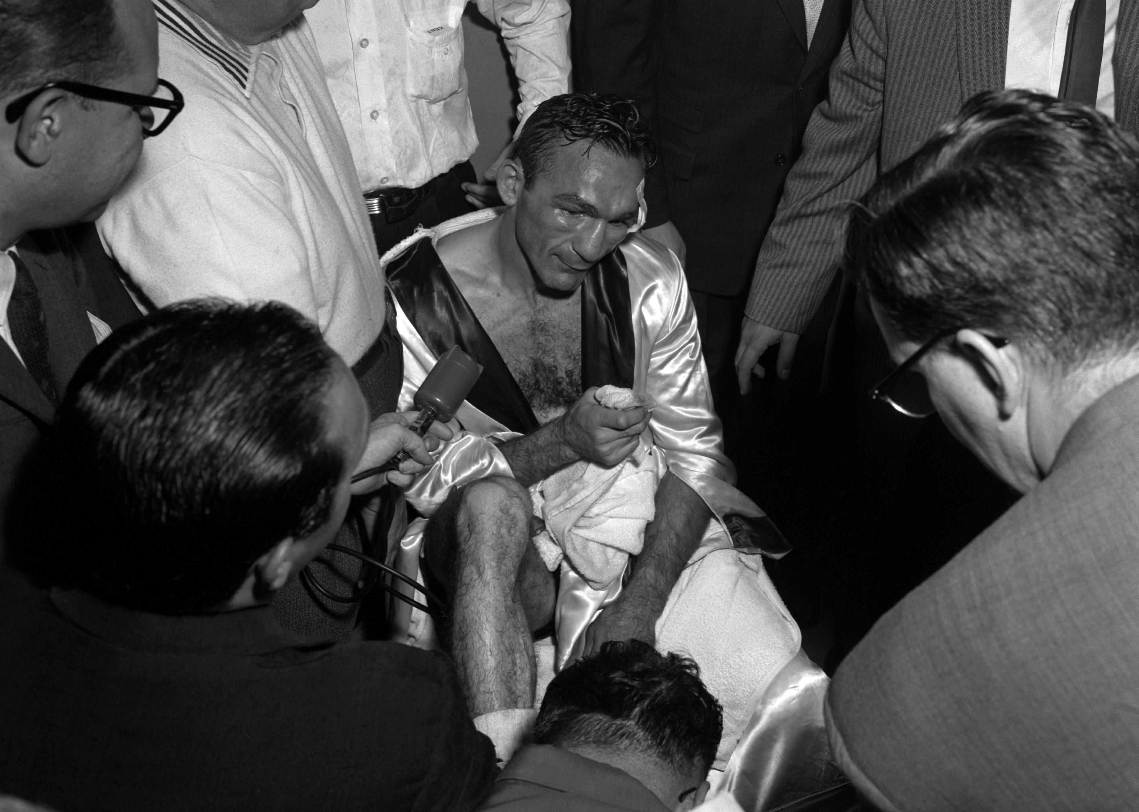 Carmen Basilio talking to the press after winning the middleweight title from Sugar Ray Robinson in Yankee Stadium.