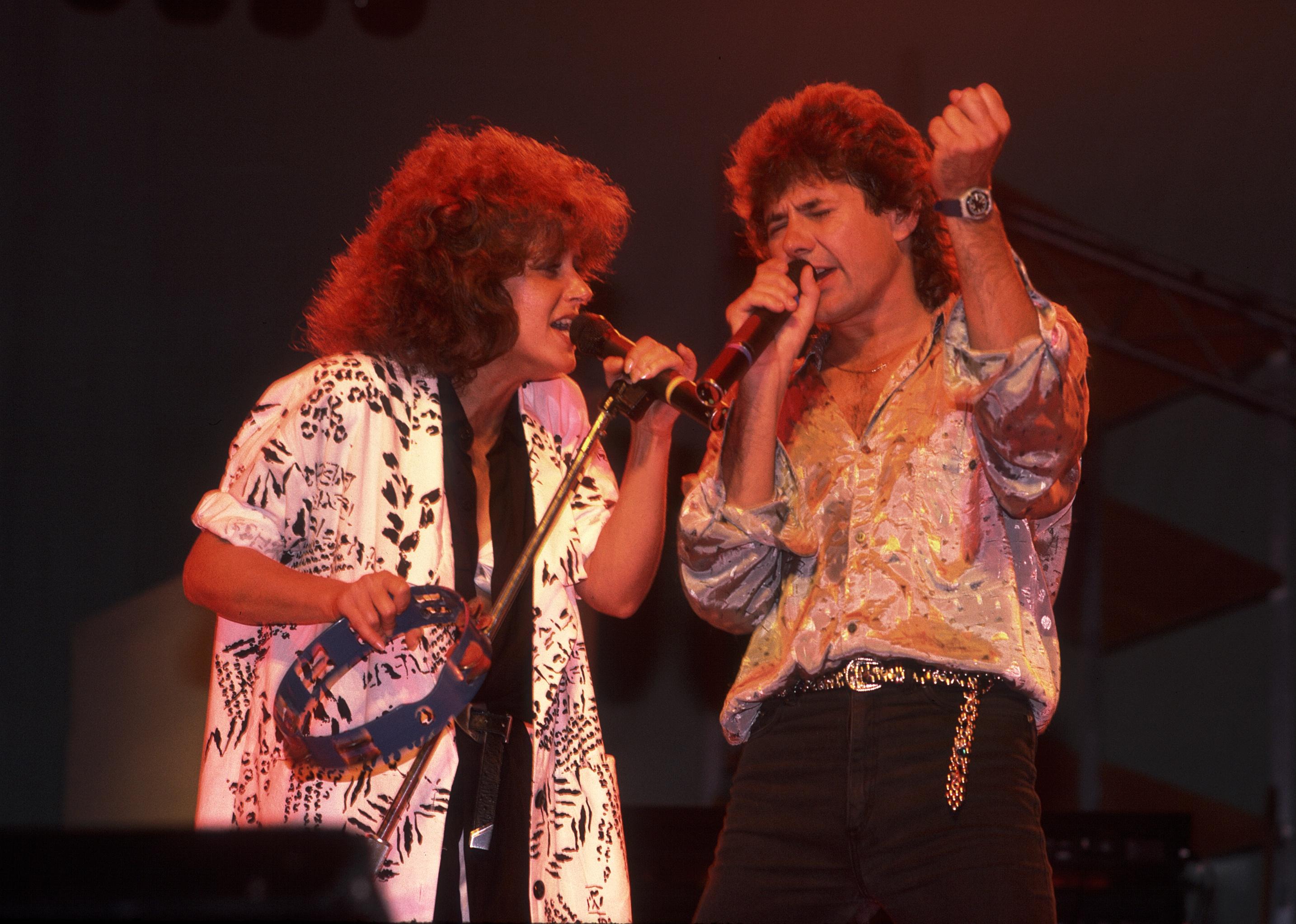 Grace Slick and Mickey Thomas of Starship performing on stage.