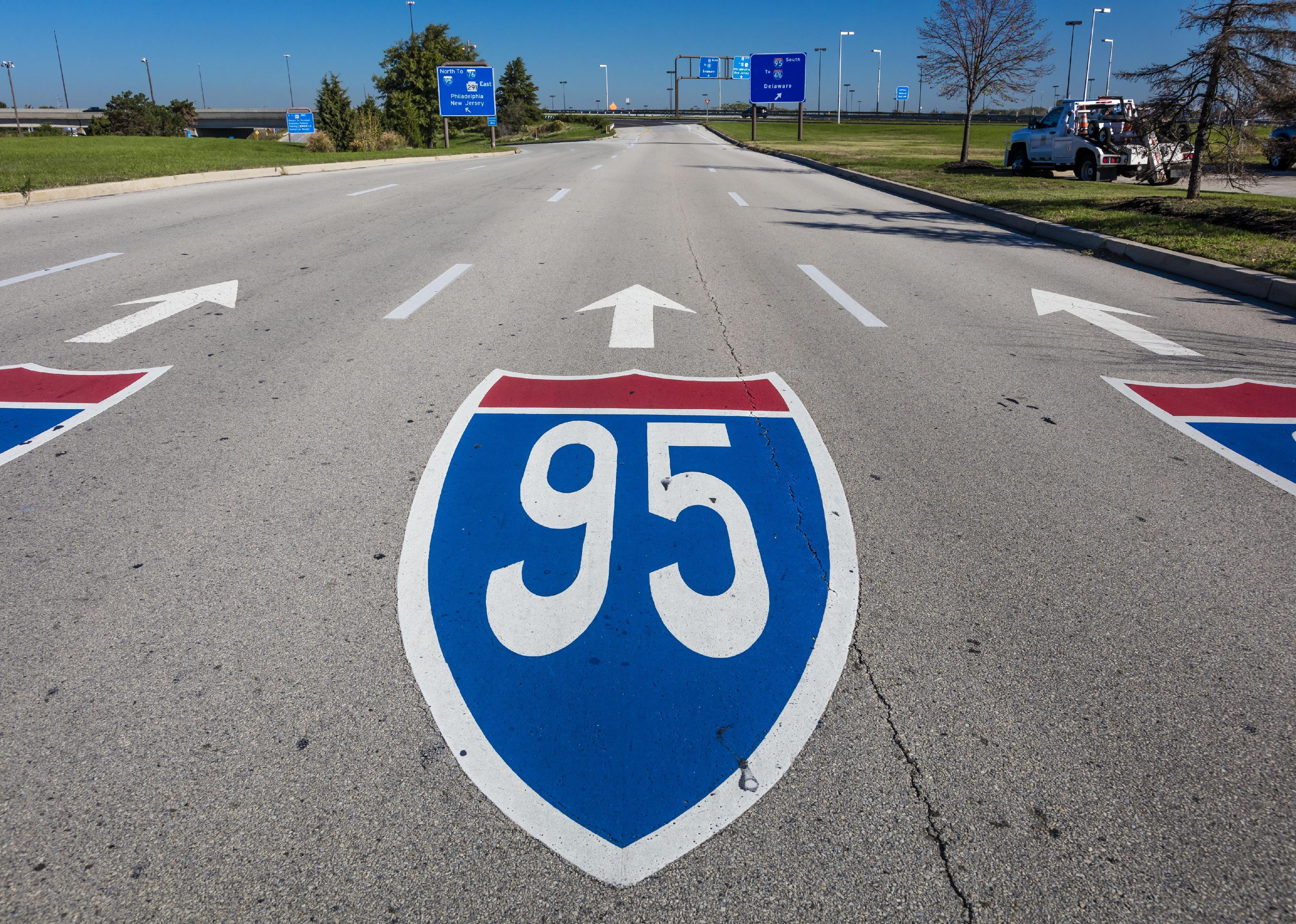 Interstate 95 road sign painted on a modern roadway.
