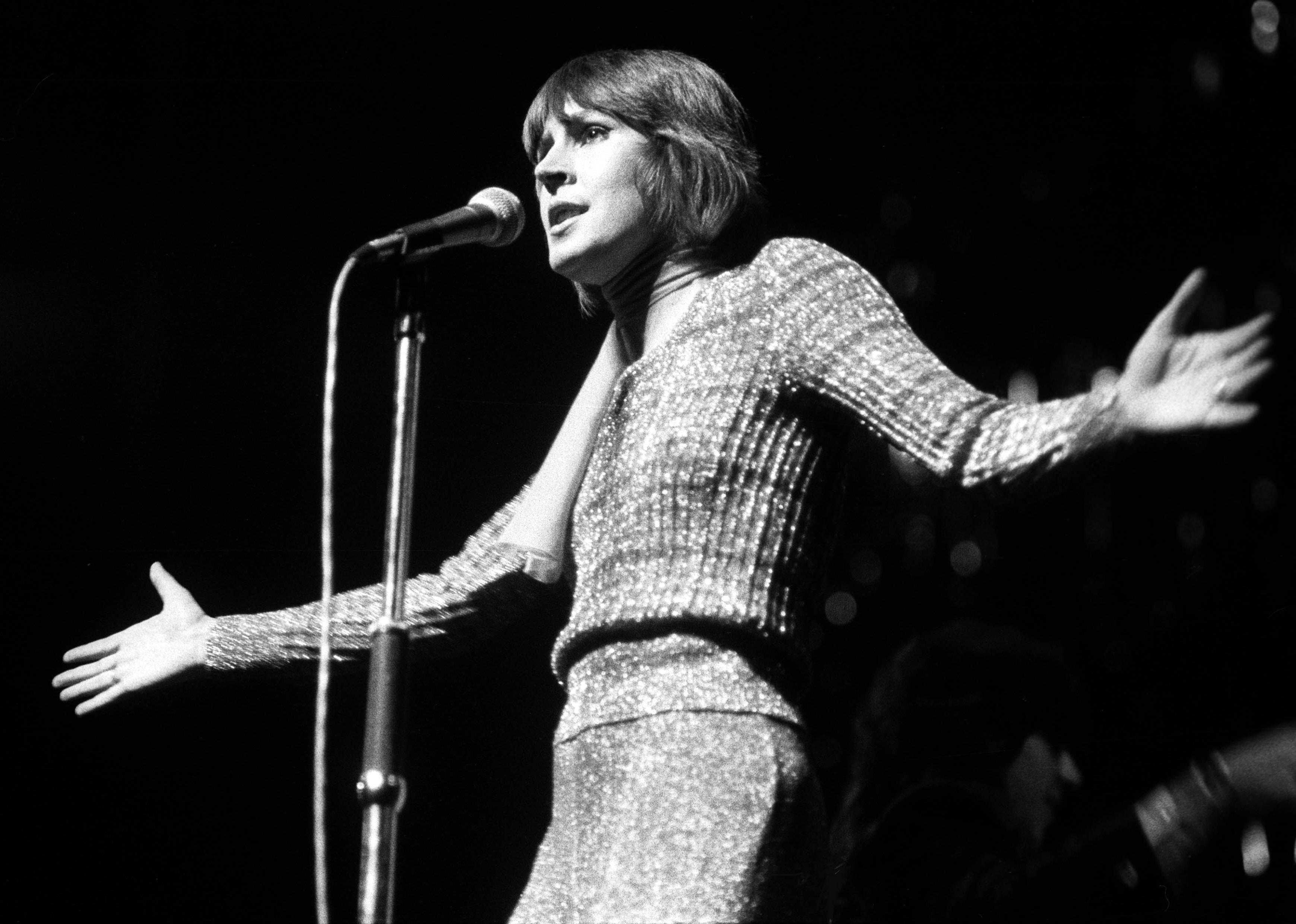 Helen Reddy performing on stage.