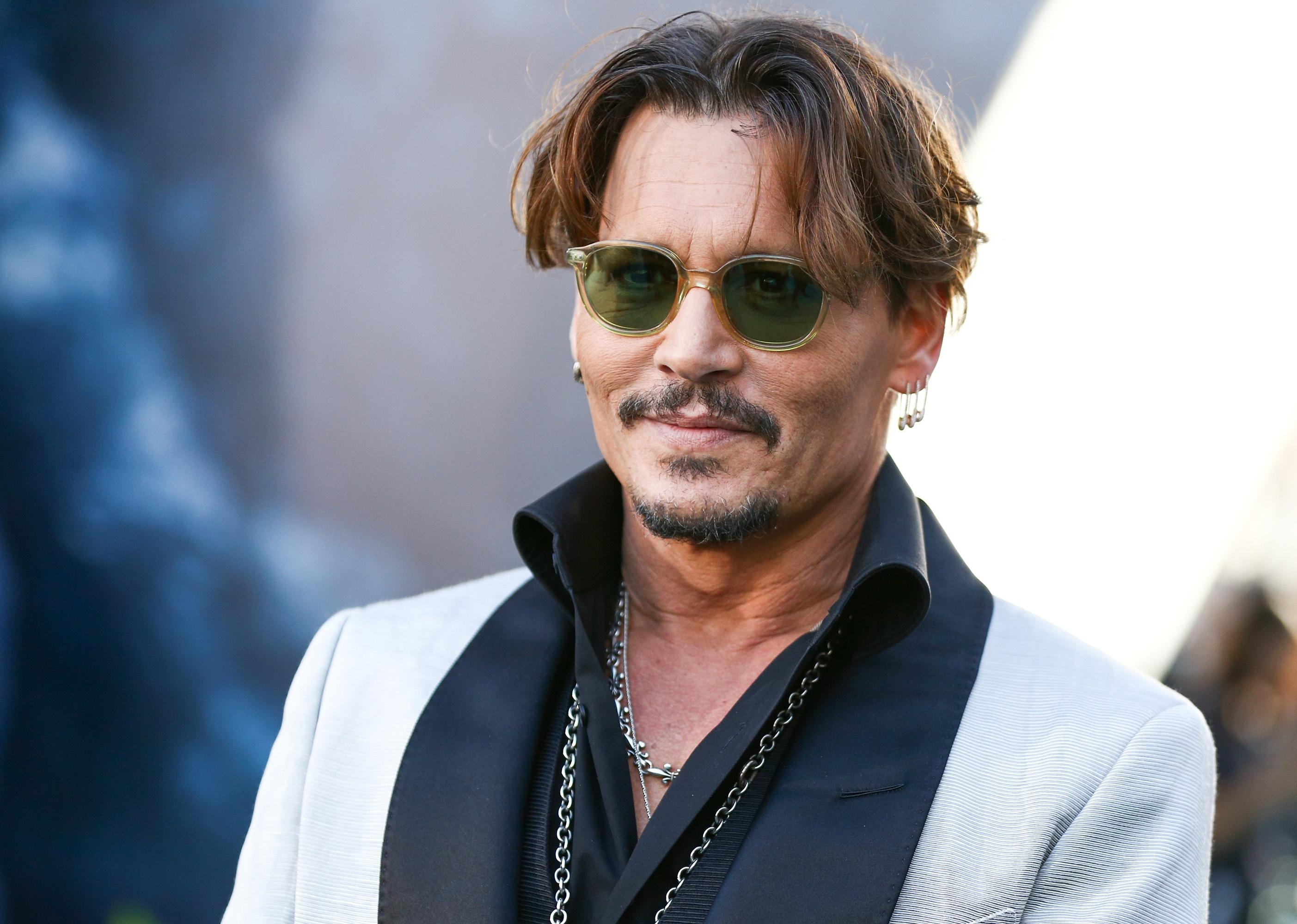 Johnny Depp attends the premiere of Disney