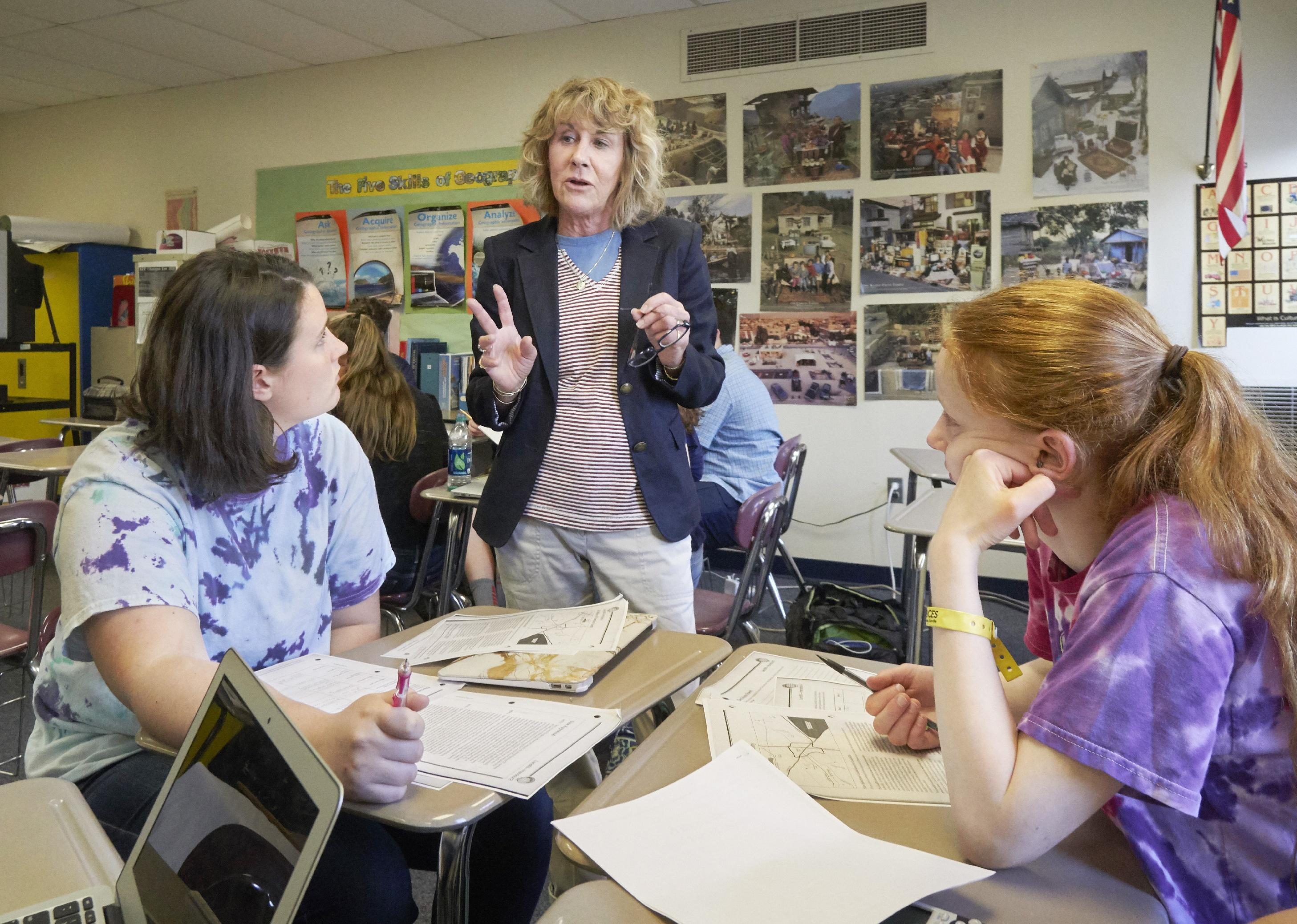 Social Studies teacher talks to sophomores 