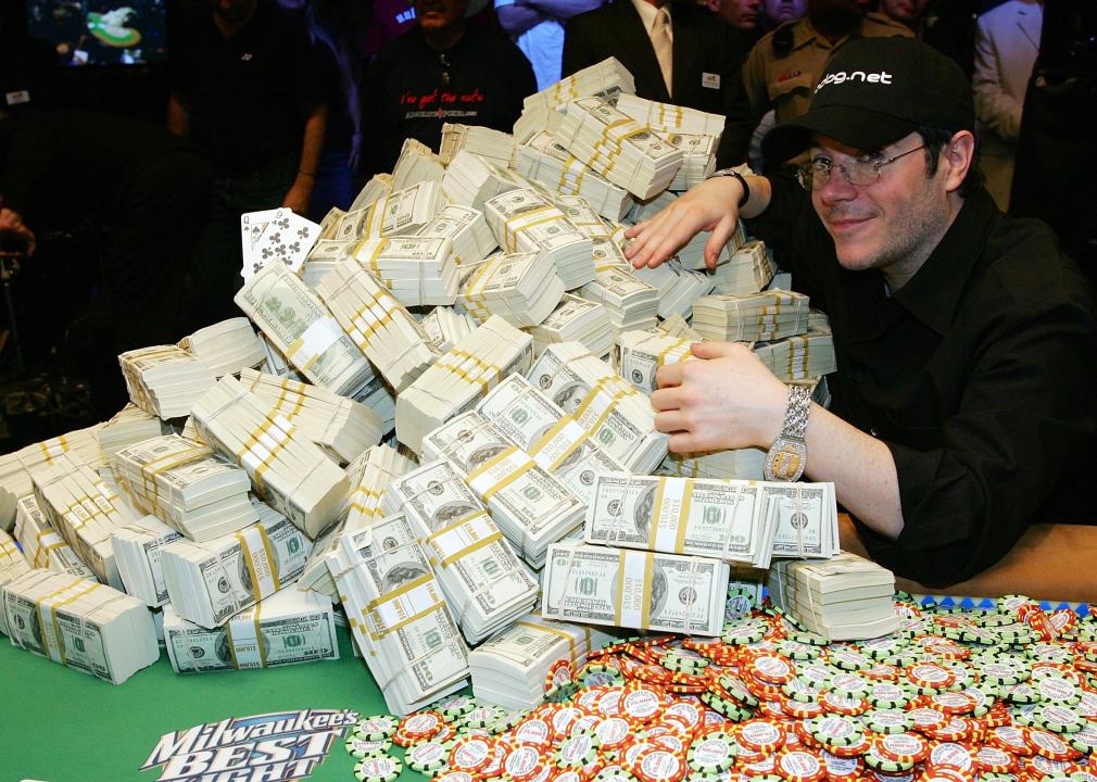 Jamie Gold poses with the $12 million he won in the World Series of Poker.