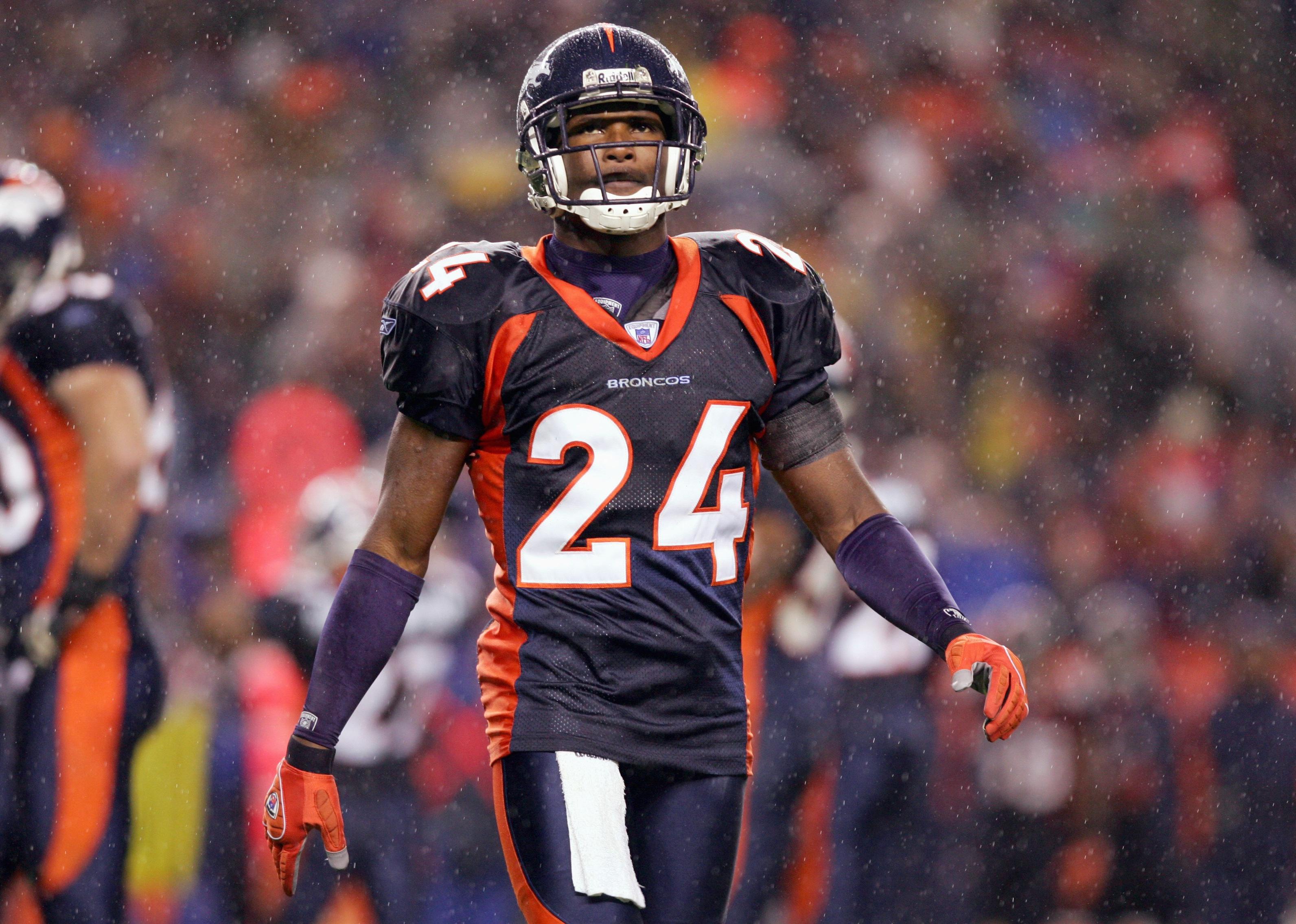 Champ Bailey of the Denver Broncos walks on the field 