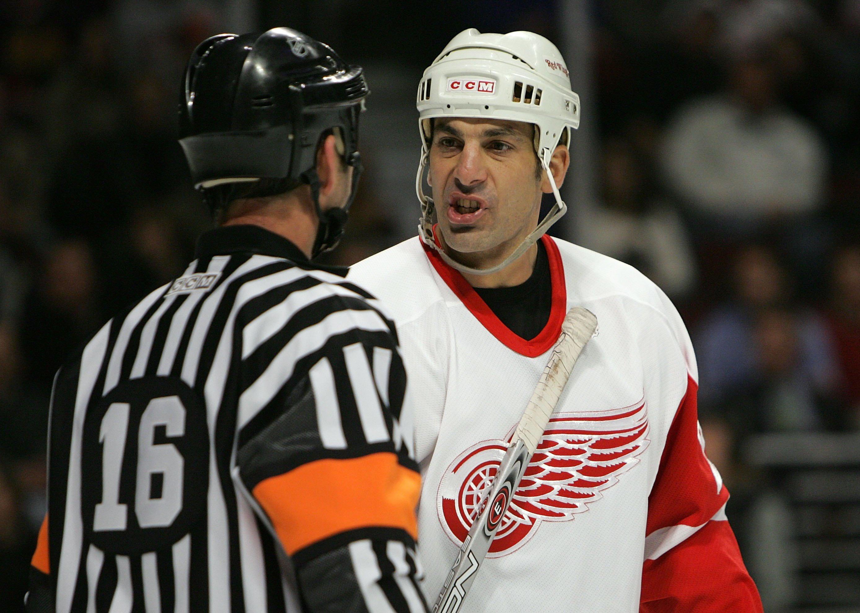 Chris Chelios of the Detroit Red Wings talks with a referee.