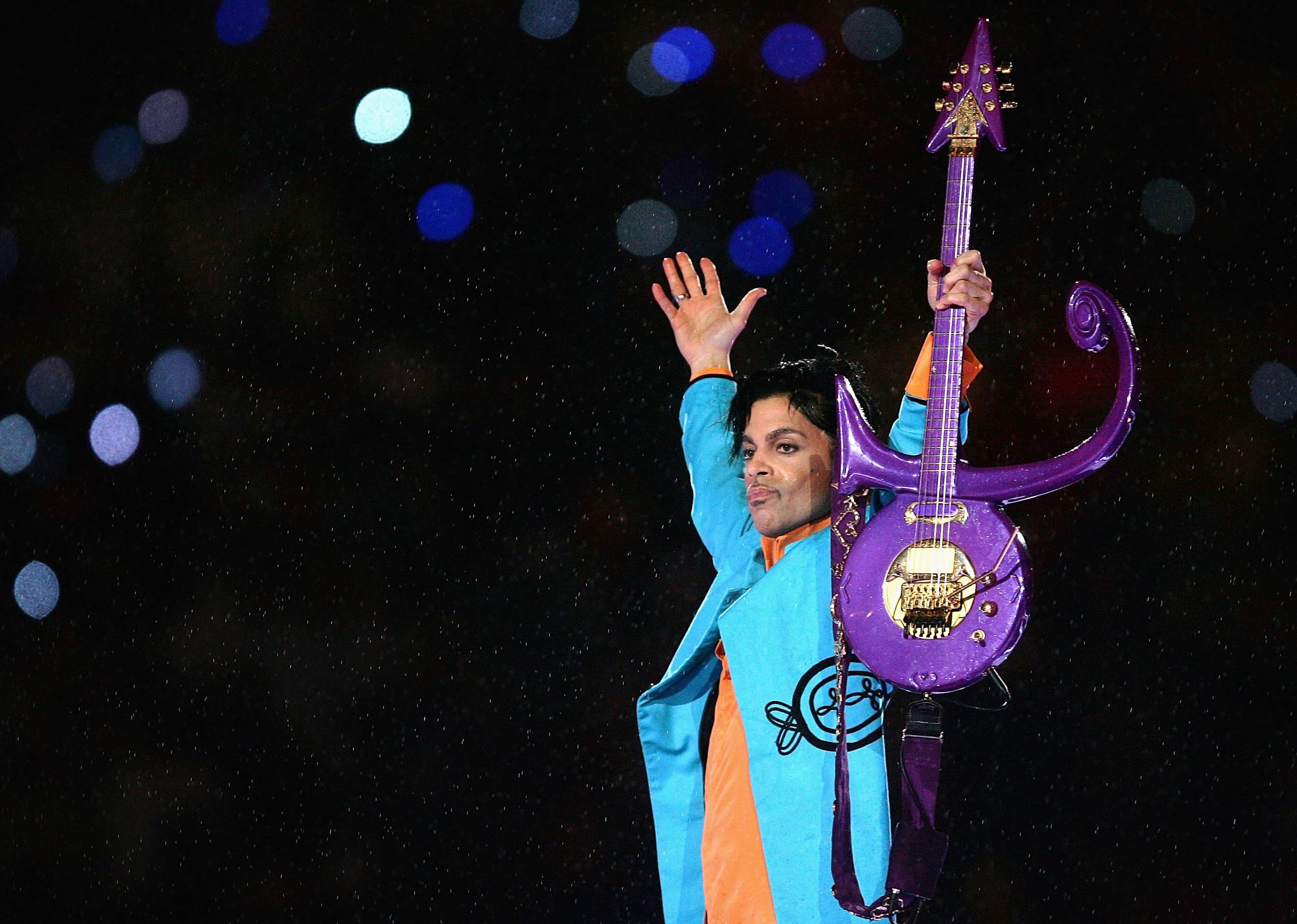 Prince performs during the Super Bowl XLI halftime show sponsored by Pepsi.