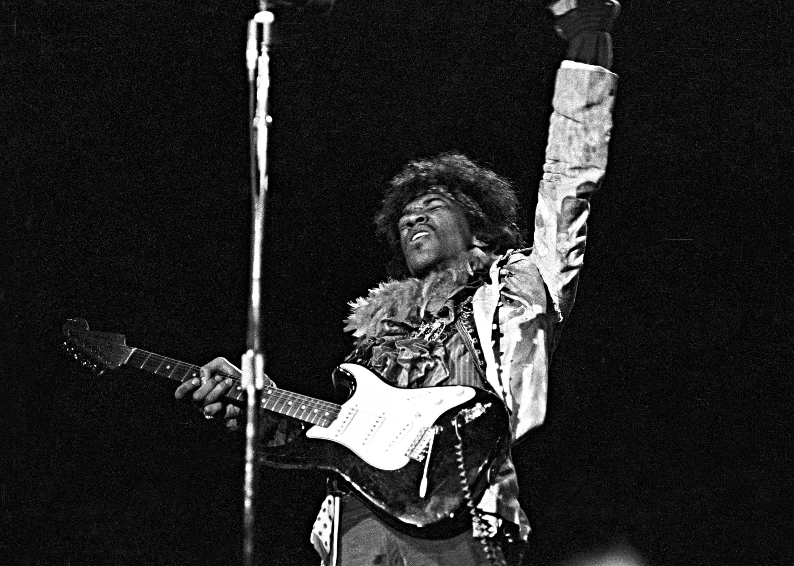 Jimi Hendrix performs onstage at the Monterey Pop Festival.