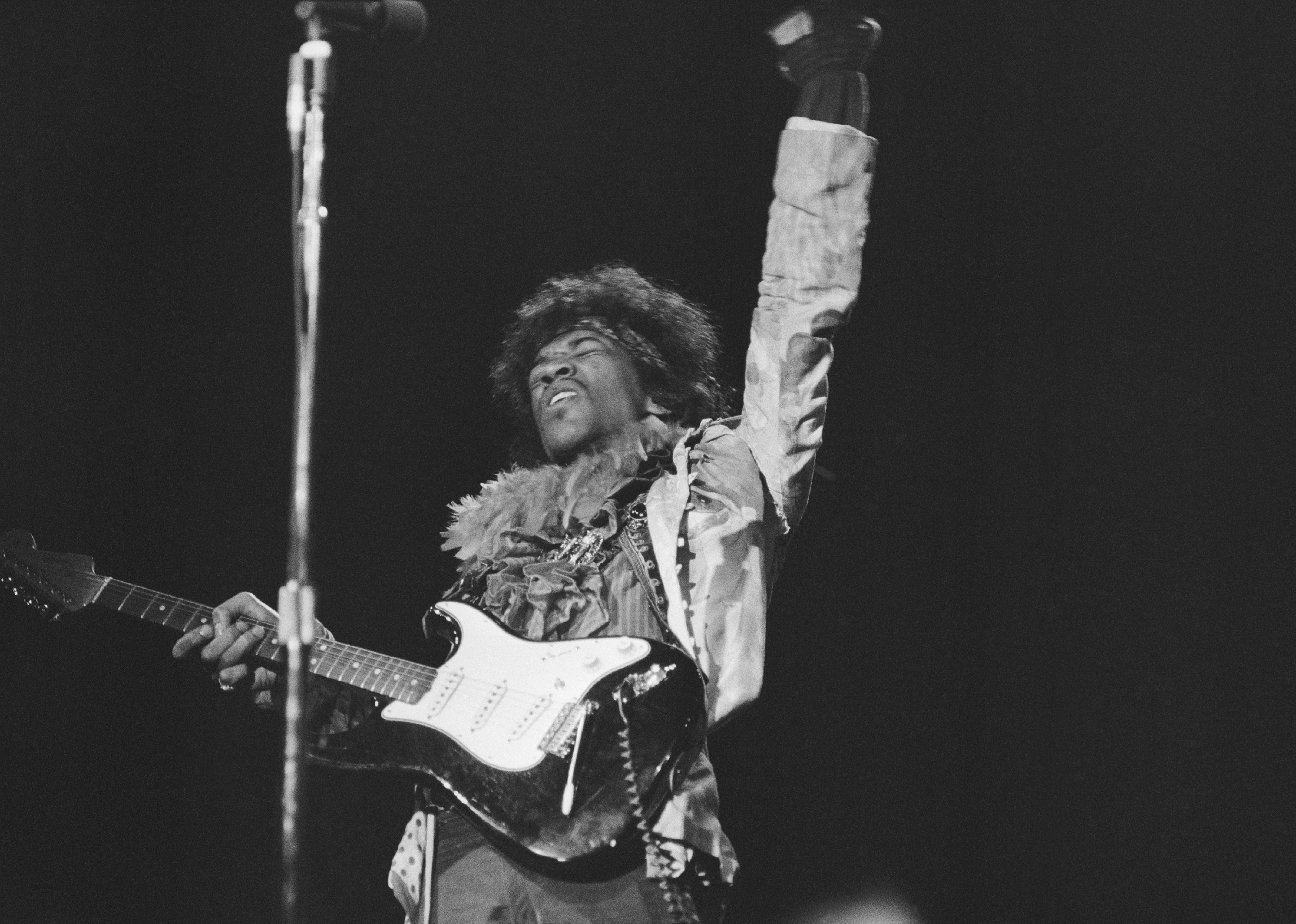 Jimi Hendrix performs onstage at the Monterey Pop Festival.