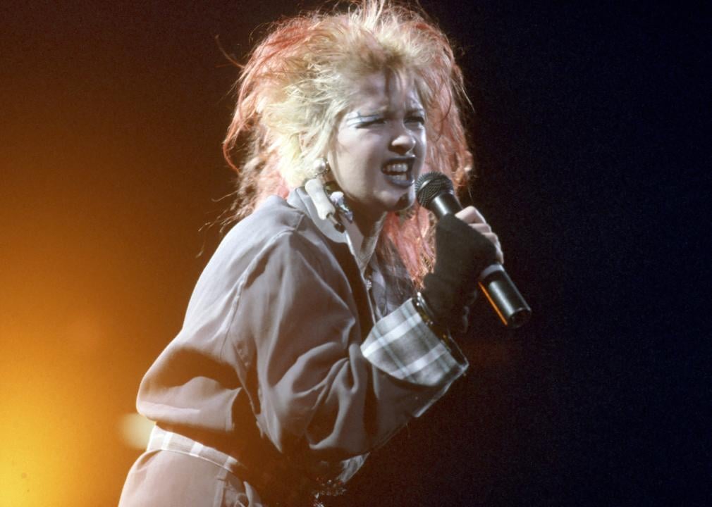 Cyndi Lauper performing on stage.