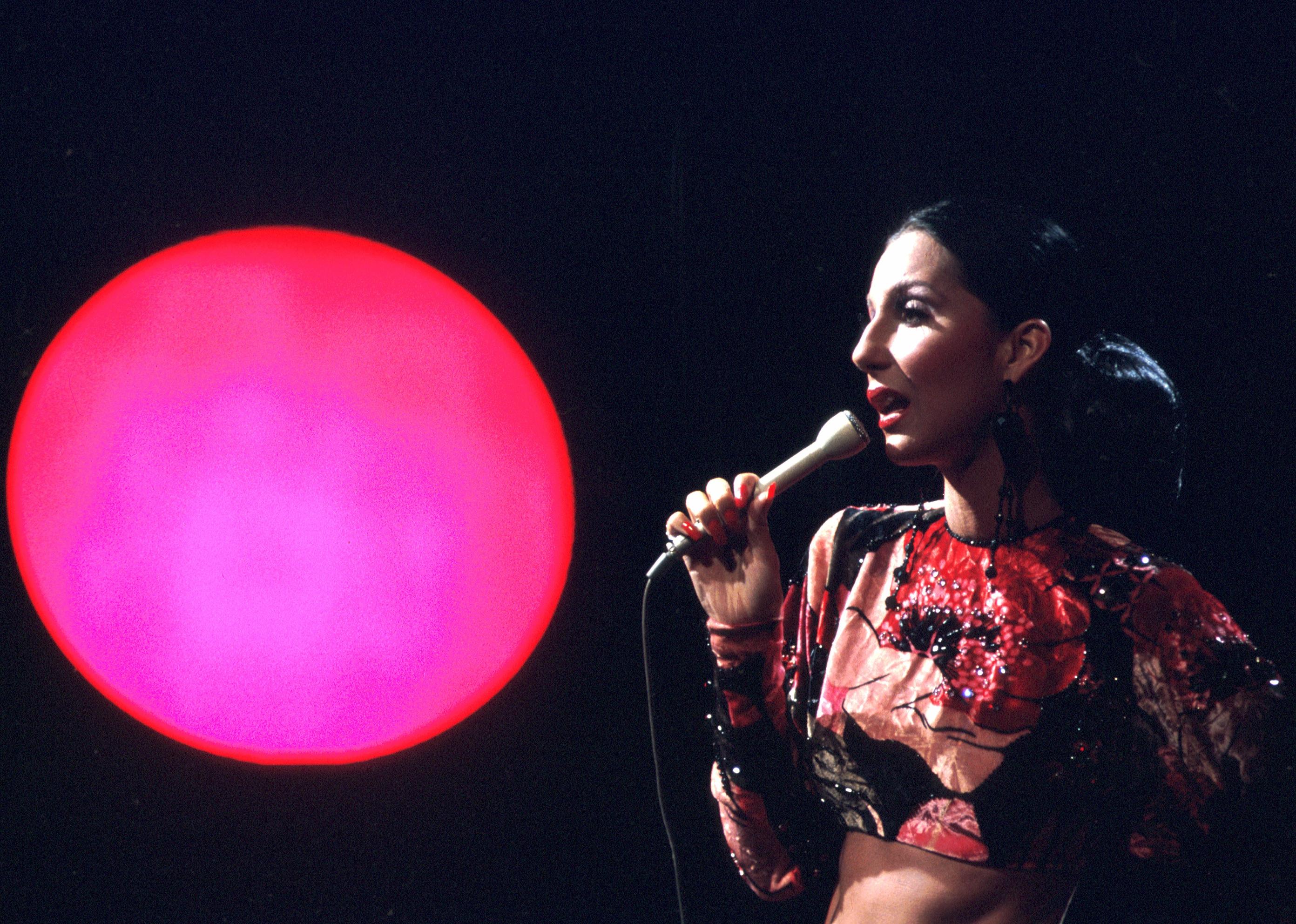 Cher performs on stage in August 1972. 