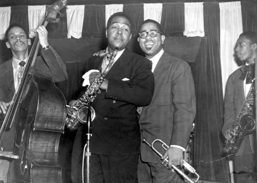Charlie Parker on stage with three other musicians.