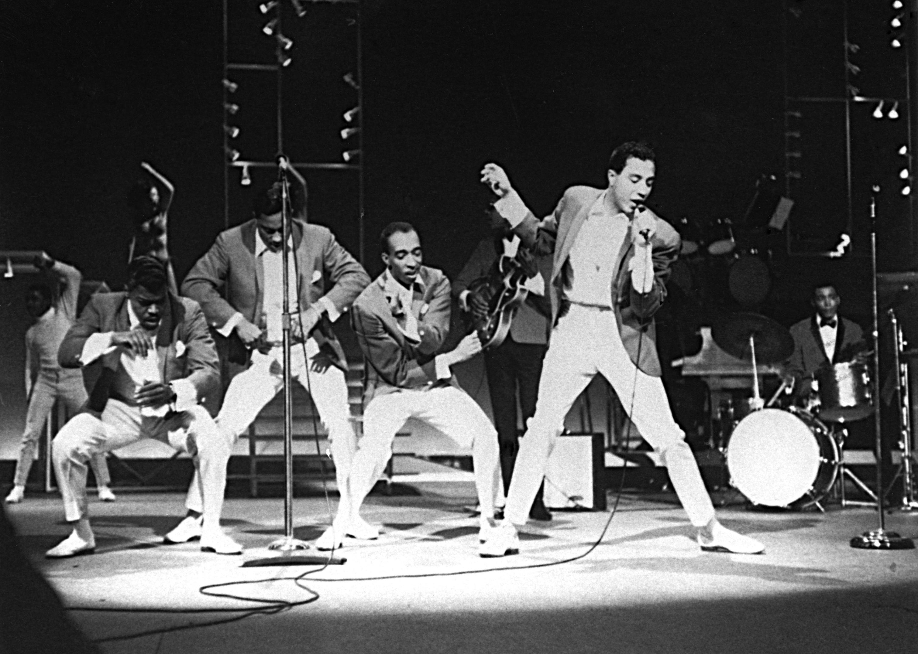Smokey Robinson and the Miracles Gaye perform onstage during the concert movie "The T.A.M.I. Show".