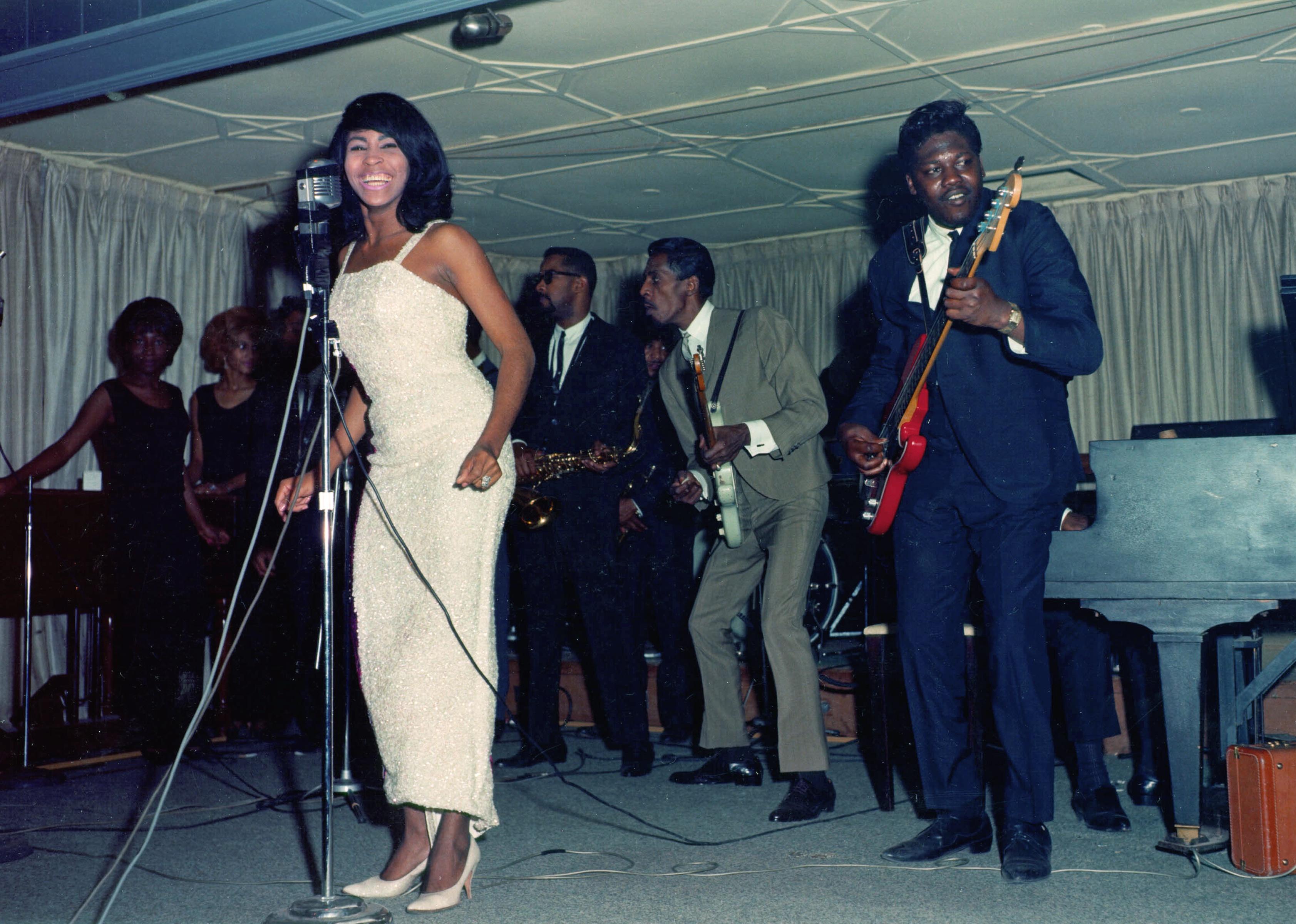 Ike & Tina Turner perform onstage with a Fender Stratocaster electric guitar in 1964.