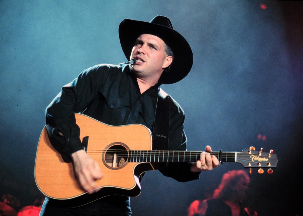 Garth Brooks performs onstage in 1994