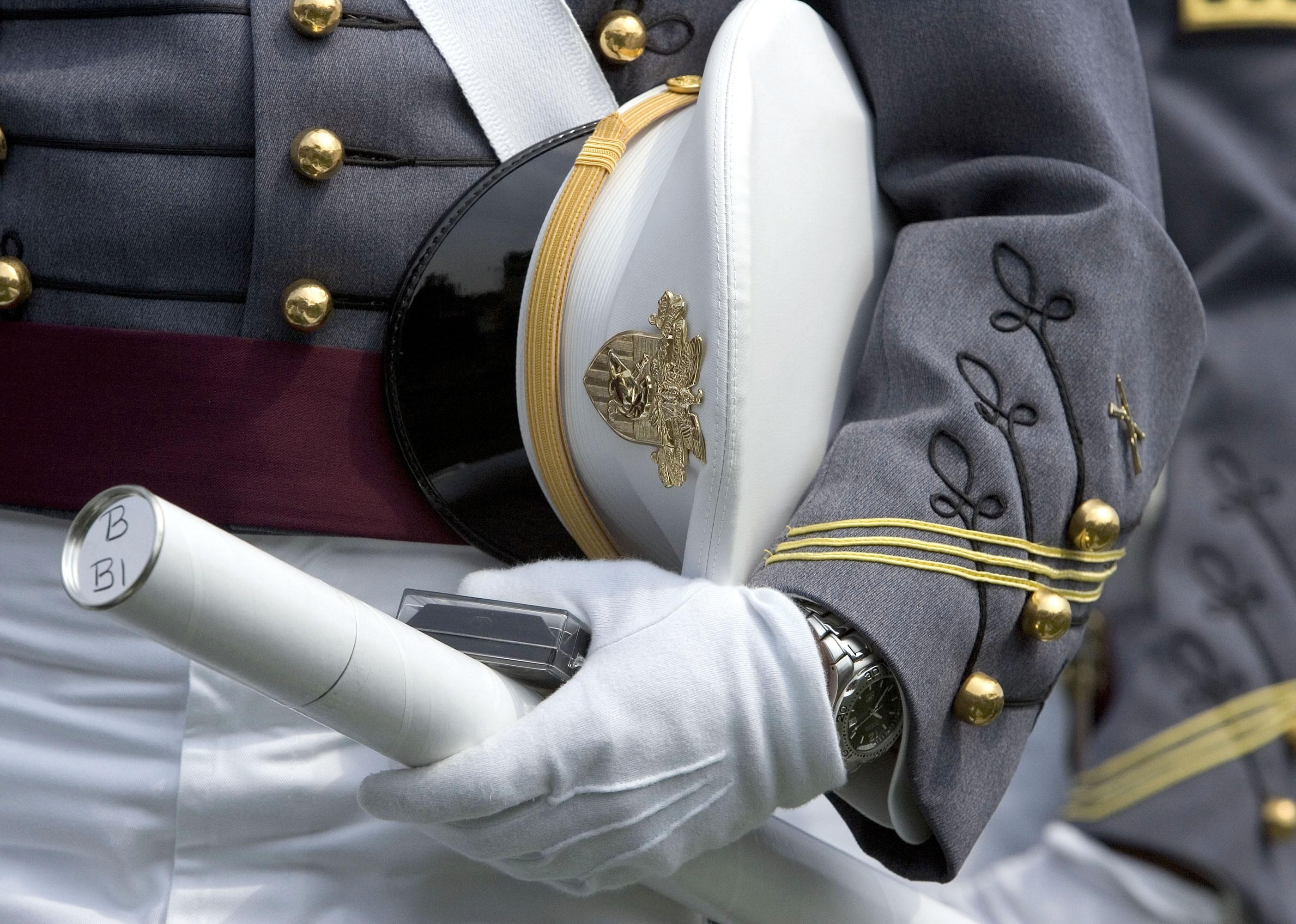 A cadet holds his diploma and cap during the graduation ceremony at the U.S. Military Academy.