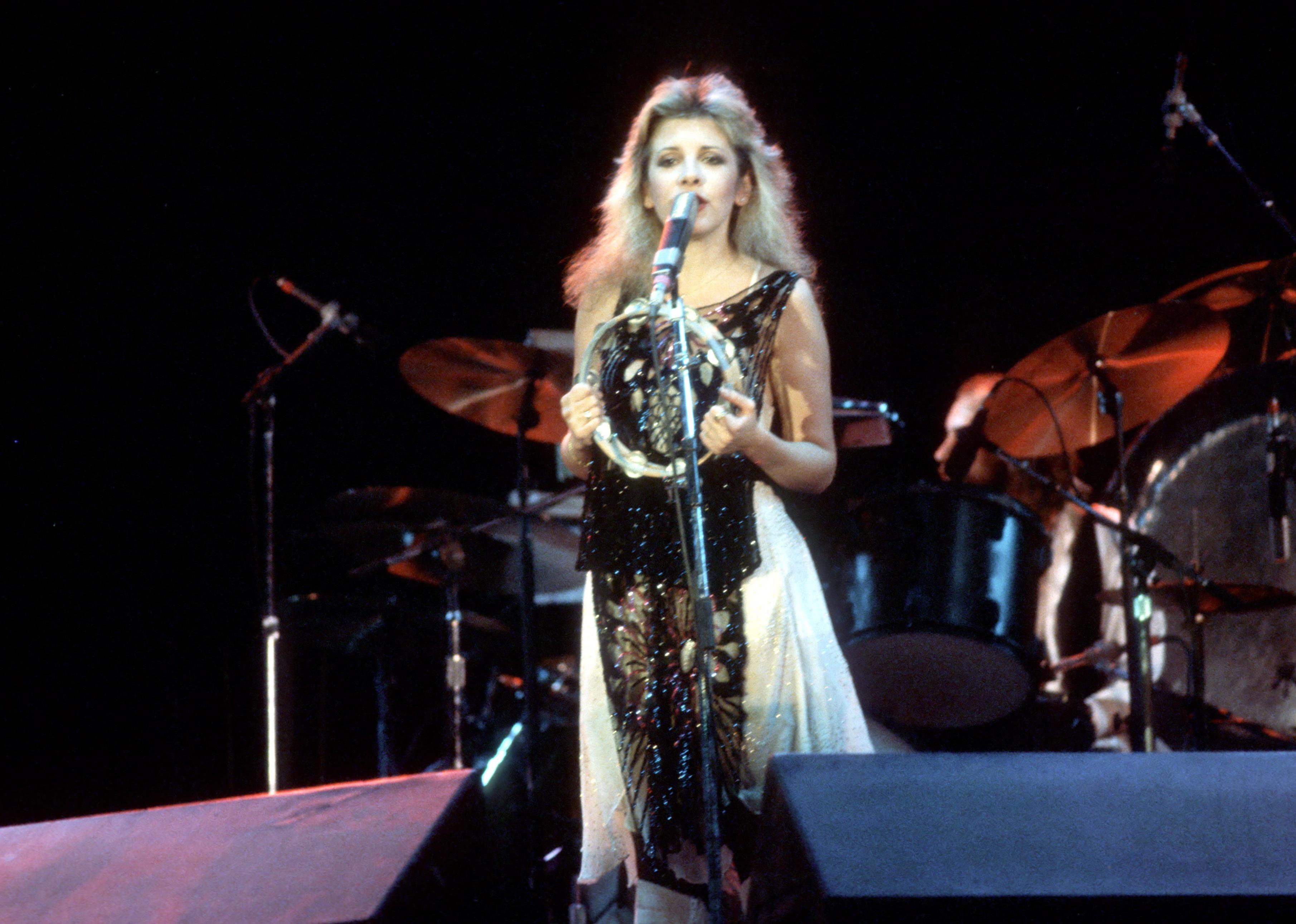 Musicians Tom Petty and Stevie Nicks perform onstage in 1981.