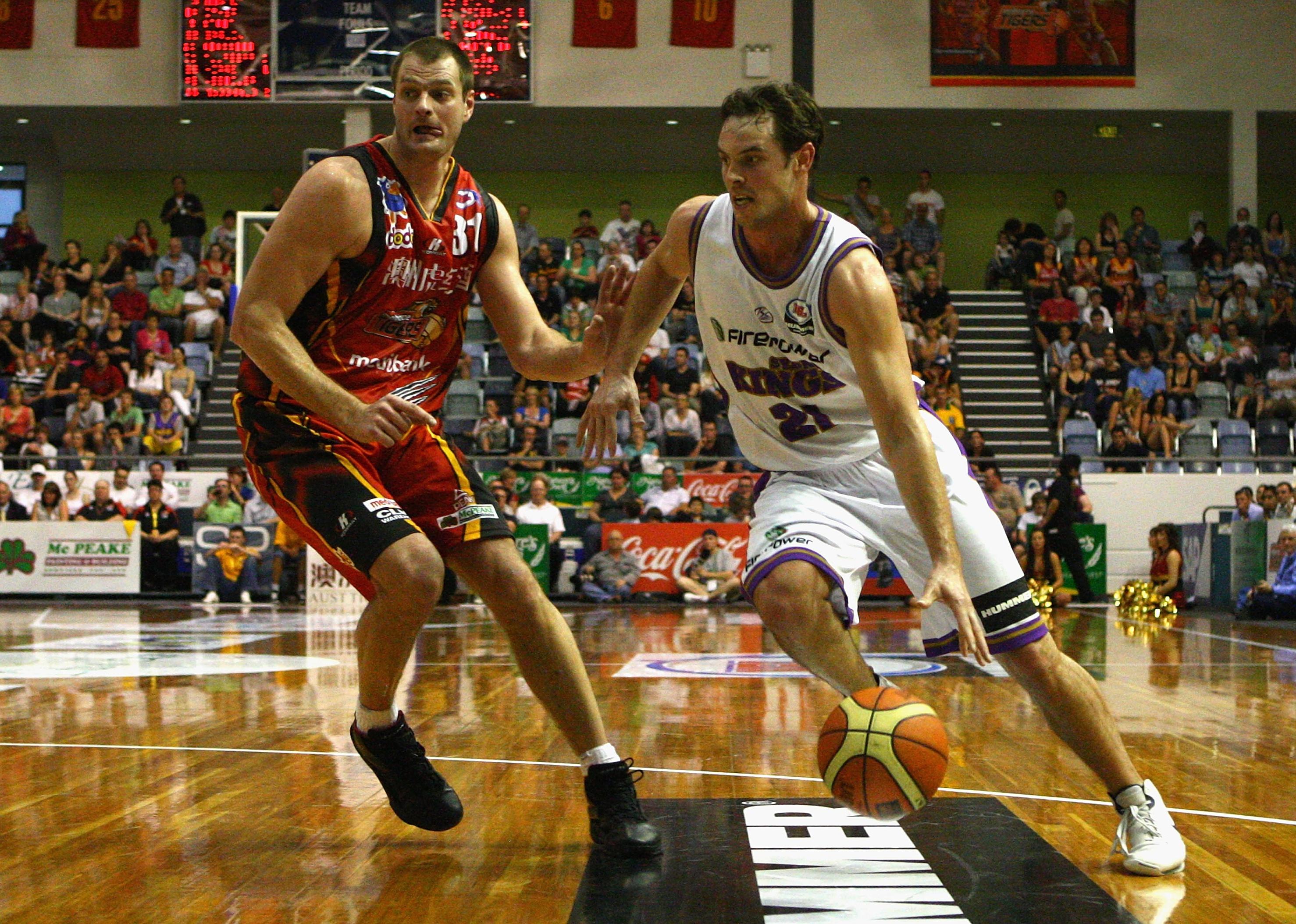 Martin Muursepp puts pressure on an opposing player during a game.